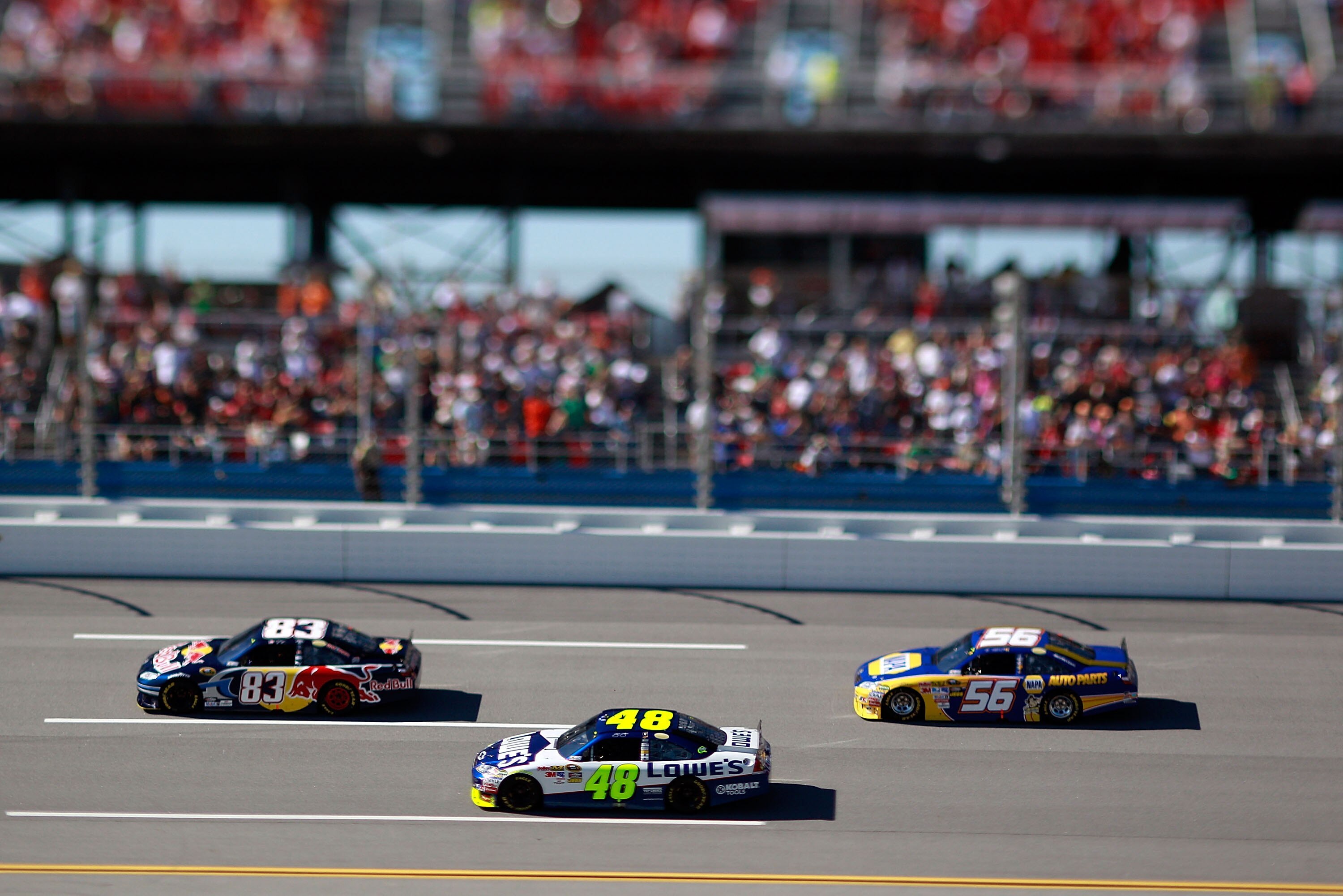 TALLADEGA, AL - OCTOBER 31:  (***EDITORS NOTE*** - THIS DIGITAL IMAGE WAS CREATED WITH THE USE OF VARIABLE FOCAL PLANE LENS) Kasey Kahne, driver of the #83 Red Bull Toyota, leads a pack of cars during the NASCAR Sprint Cup Series AMP Energy Juice 500 at T
