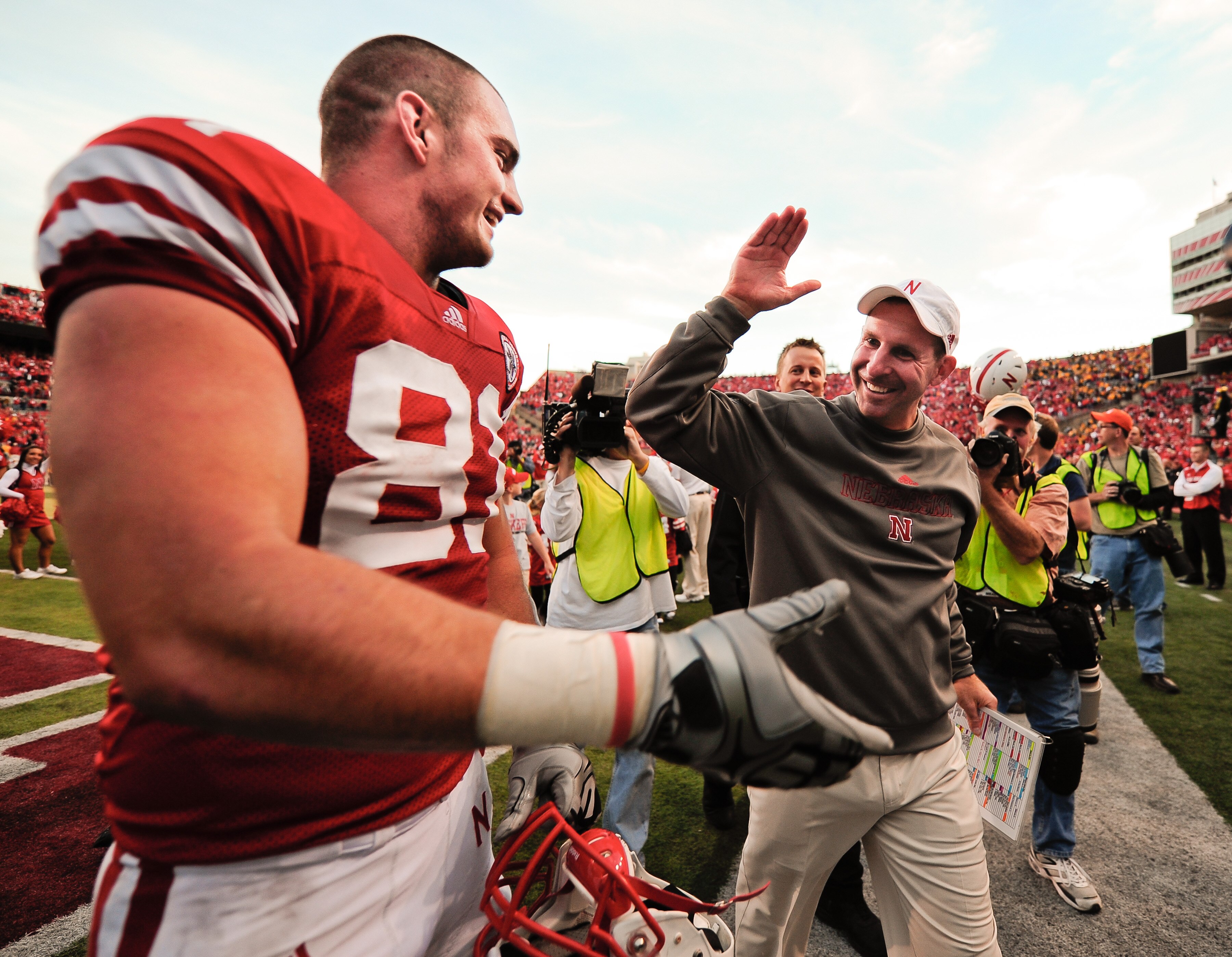 LINCOLN, NE - OCTOBER 30: Coach Bo Pelini of the Nebraska Cornhuskers high fives tight end Ben Cotton #81 after their game against the Missouri Tigers at Memorial Stadium on October 30, 2010 in Lincoln, Nebraska. Nebraska Defeated Missouri 31-17. (Photo b