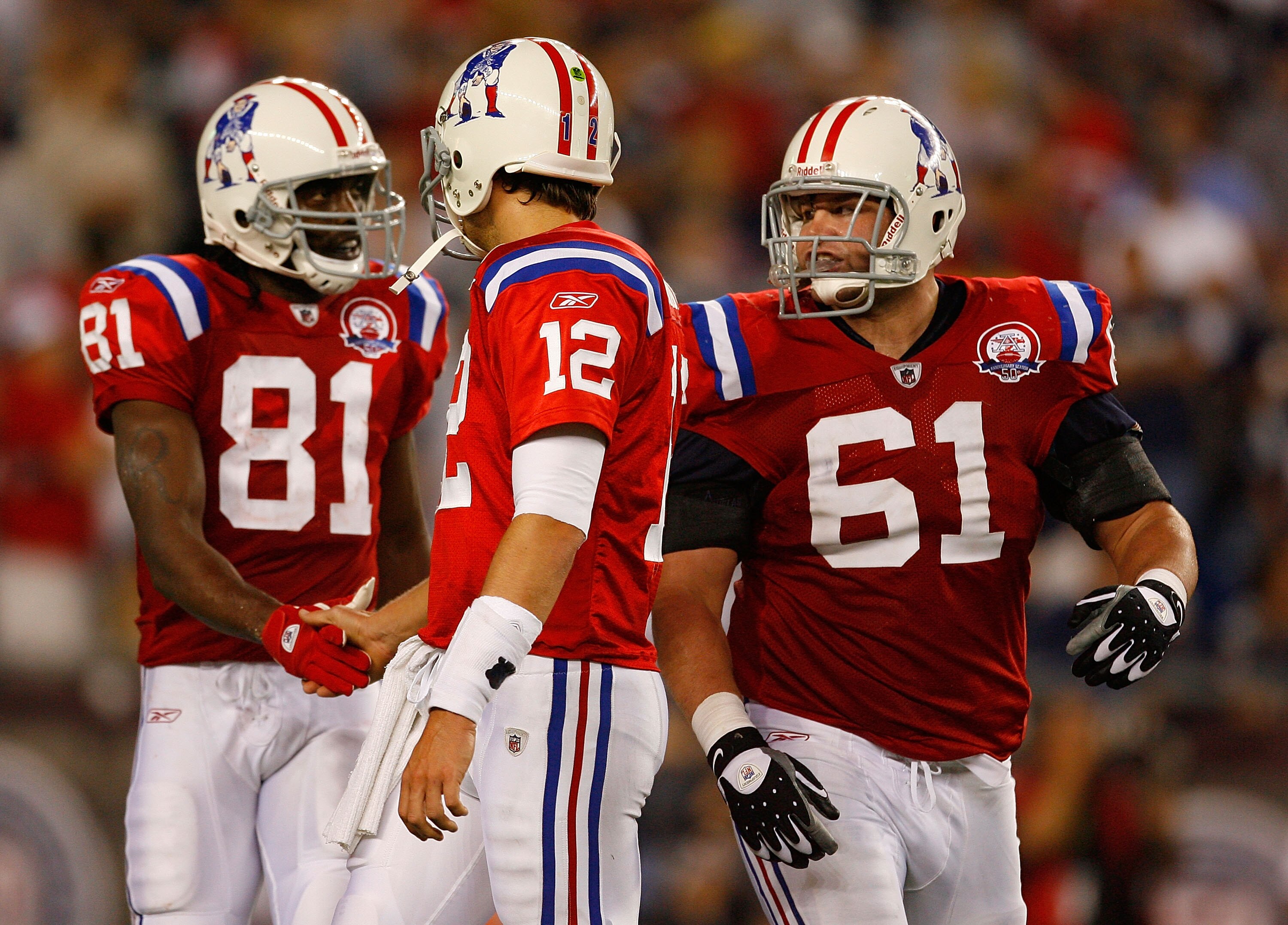 FOXBORO, MA - SEPTEMBER 14:  Tom Brady #12 is congratulated by Randy Moss #81 and of the New England Patriots   of the Buffalo Bills at Gillette Stadium on September 14, 2009 in Foxboro, Massachusetts. (Photo by Jim Rogash/Getty Images)