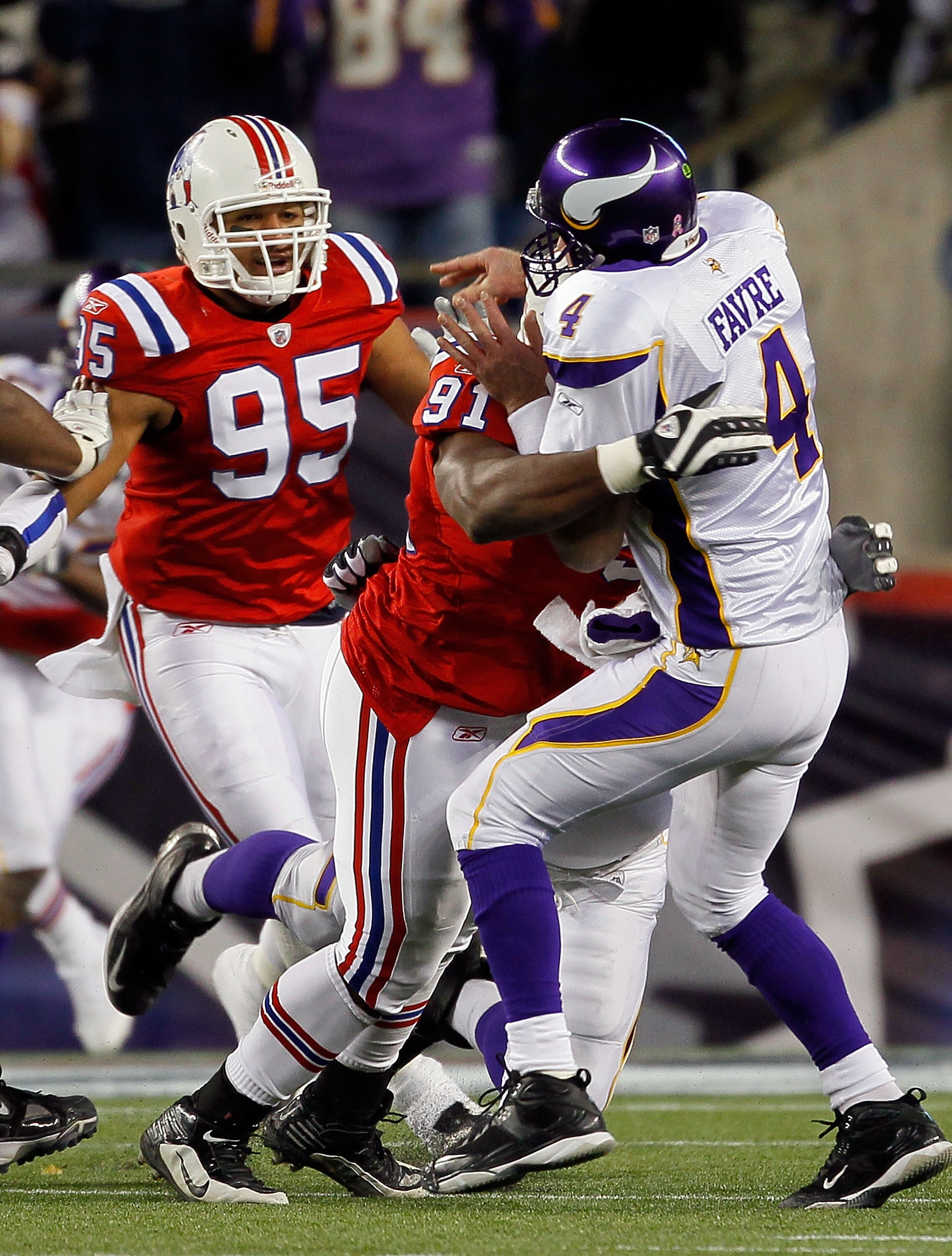 FOXBORO, MA - OCTOBER 31:  Brett Favre #4 of the Minnesota Vikings is hit by defensive tackle Myron Pryor #91 of the New England Patriots in the fourth quarter against the New England Patriots at Gillette Stadium on October 31, 2010 in Foxboro, Massachuse