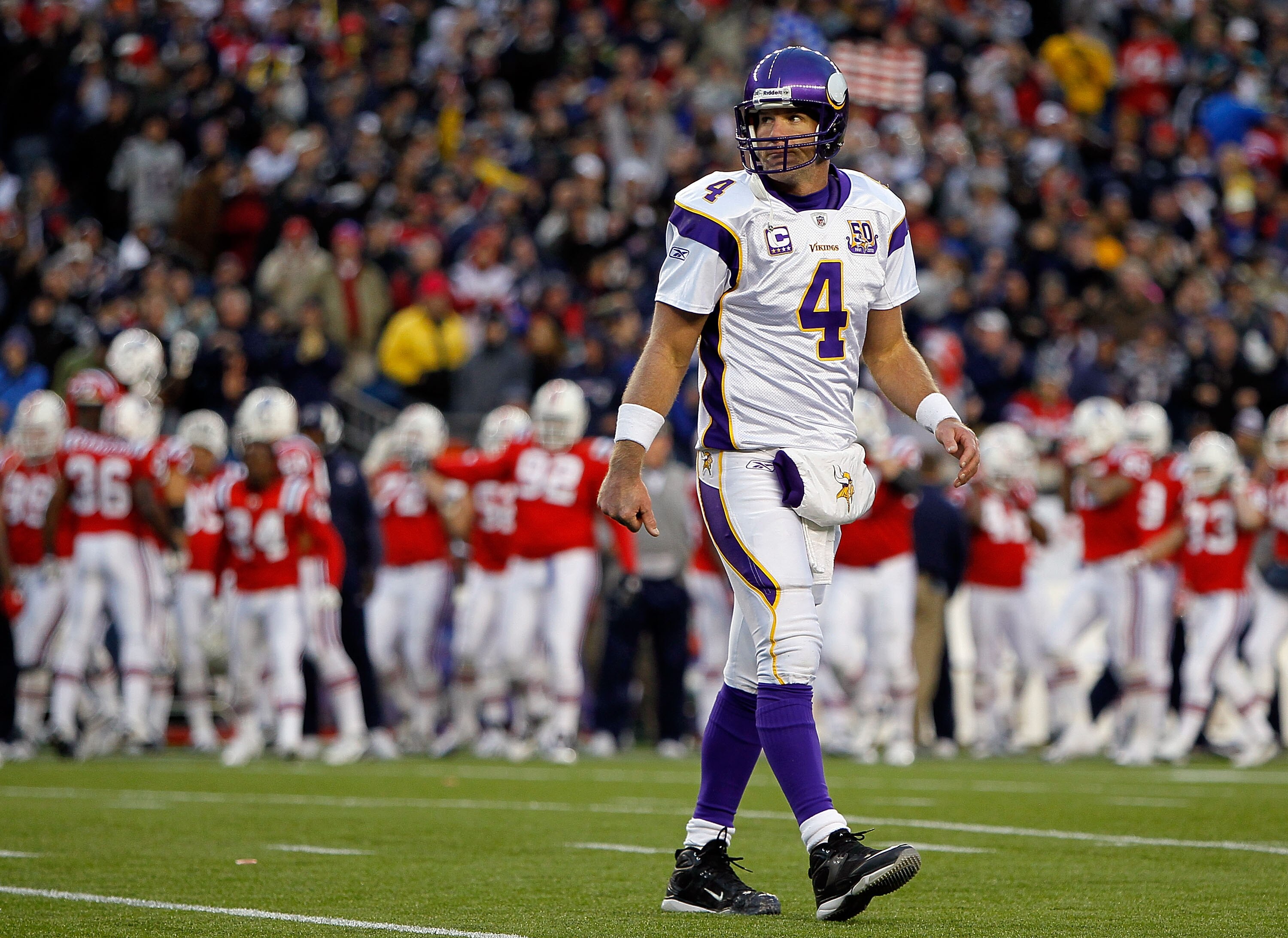 FOXBORO, MA - OCTOBER 31:  Brett Favre #4 of the Minnesota Vikings walks off the field after a missed opportunity against the New England Patriots at Gillette Stadium on October 31, 2010 in Foxboro, Massachusetts. (Photo by Jim Rogash/Getty Images)