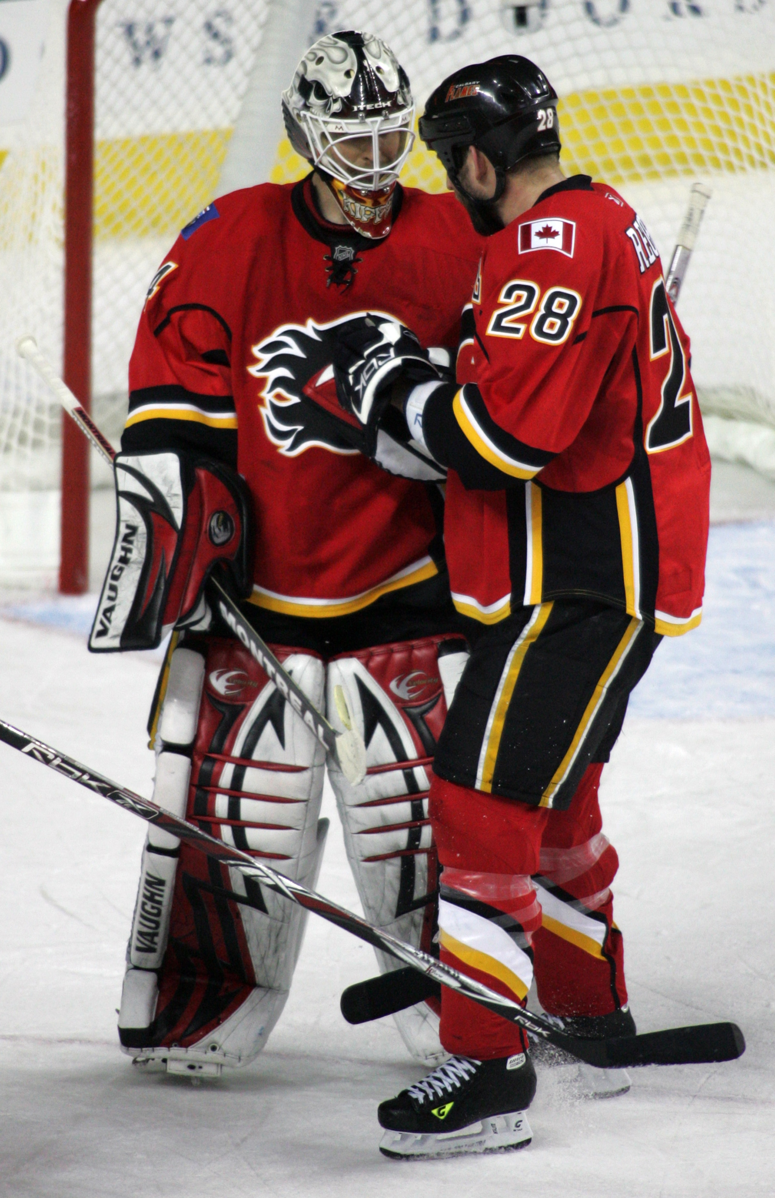CALGARY, CANADA - APRIL 20: Goaltender Miikka Kiprusoff #34 and defenceman Robyn Regehr #28 of the Calgary Flames celebrate their 2-0 victory over the San Jose Sharks during Game 6 of the 2008 NHL Western Conference Quarterfinals at Pengrowth Saddledome A CALGARY, CANADA - APRIL 20: Goaltender Miikka Kiprusoff #34 and defenceman Robyn Regehr #28 of the Calgary Flames celebrate their 2-0 victory over the San Jose Sharks during Game 6 of the 2008 NHL Western Conference Quarterfinals at Pengrowth Saddledome A