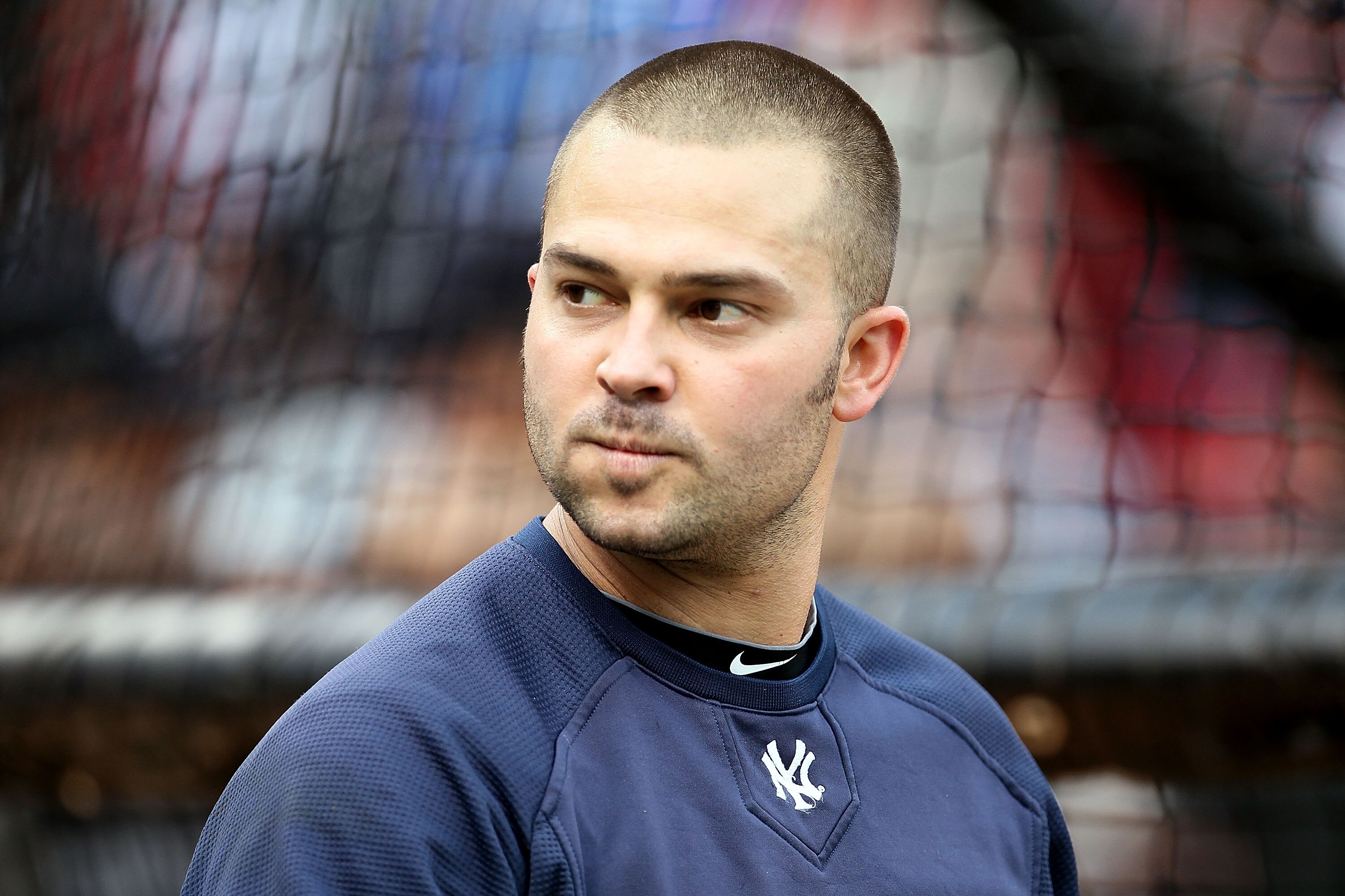 ARLINGTON, TX - OCTOBER 22:  Nick Swisher #33 of the New York Yankees looks on during batting practice against the Texas Rangers in Game Six of the ALCS during the 2010 MLB Playoffs at Rangers Ballpark in Arlington on October 22, 2010 in Arlington, Texas.