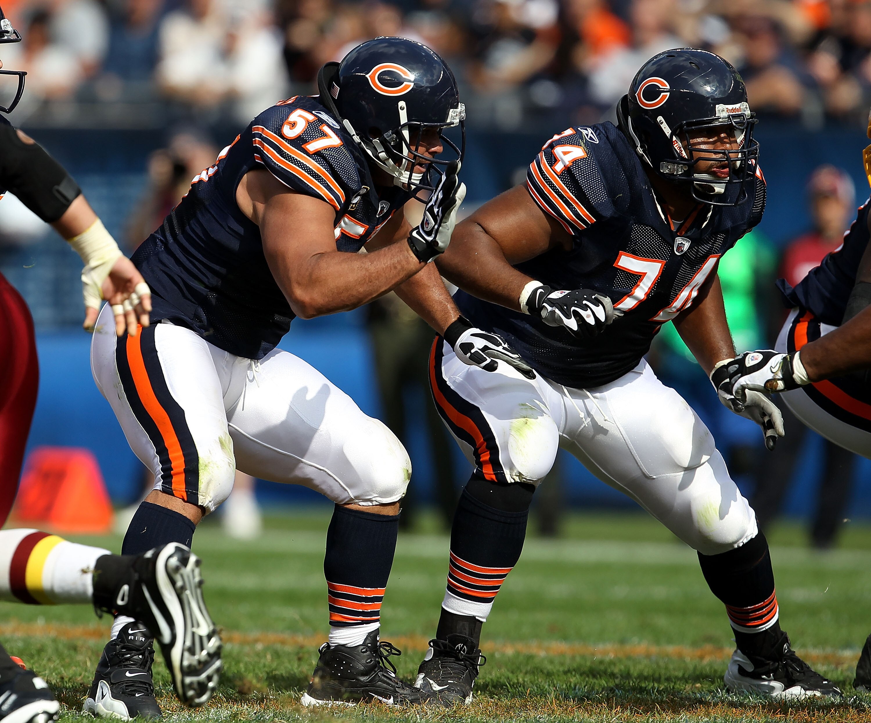 CHICAGO - OCTOBER 24: Olin Kreutz #57 and Chris Williams #74 of the Chicago Bears move to block against the Washington Redskins at Soldier Field on October 24, 2010 in Chicago, Illinois. The Redskins defeated the Bears 17-14. (Photo by Jonathan Daniel/Get