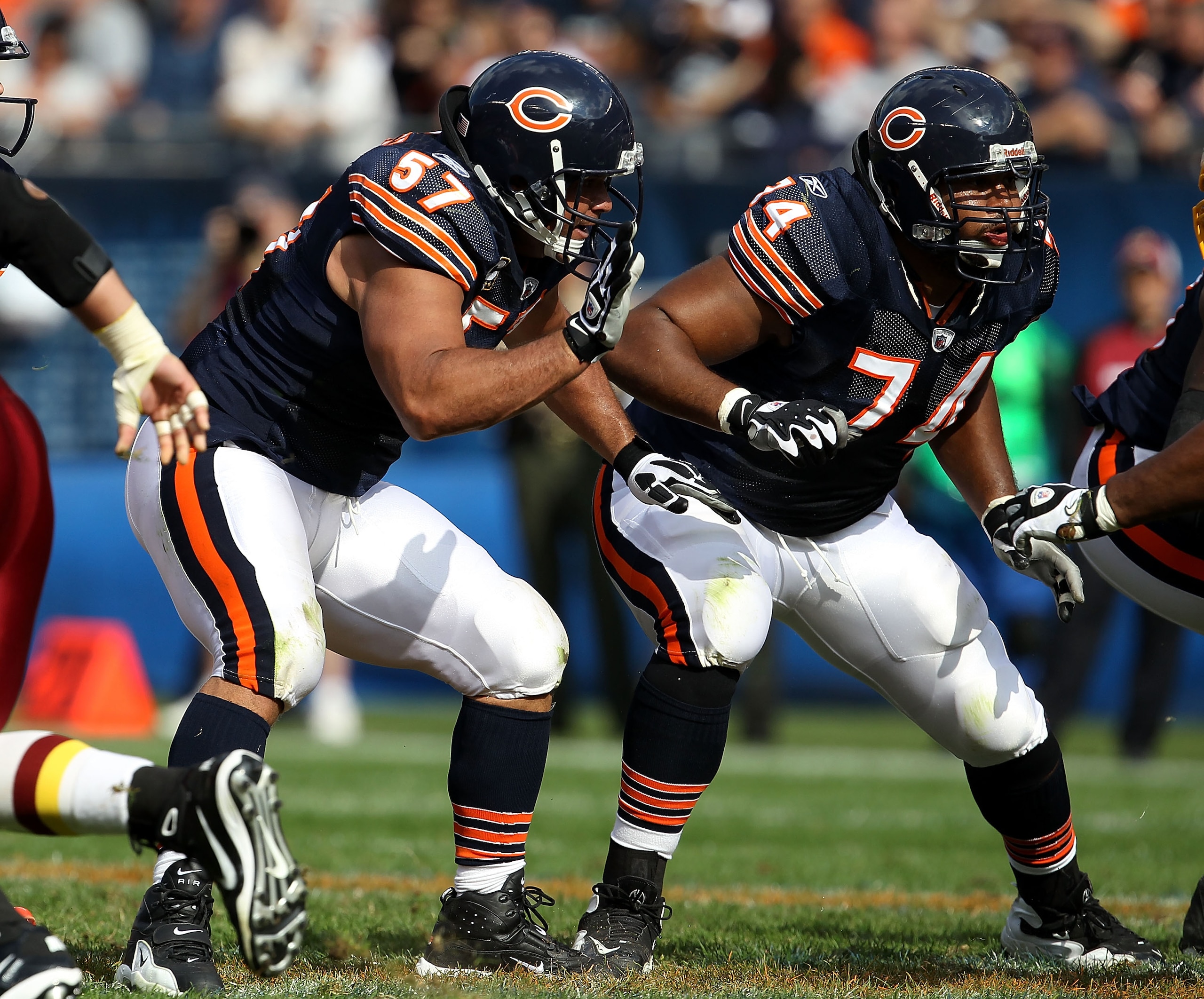 CHICAGO - OCTOBER 24: Olin Kreutz #57 and Chris Williams #74 of the Chicago Bears move to block against the Washington Redskins at Soldier Field on October 24, 2010 in Chicago, Illinois. The Redskins defeated the Bears 17-14. (Photo by Jonathan Daniel/Get