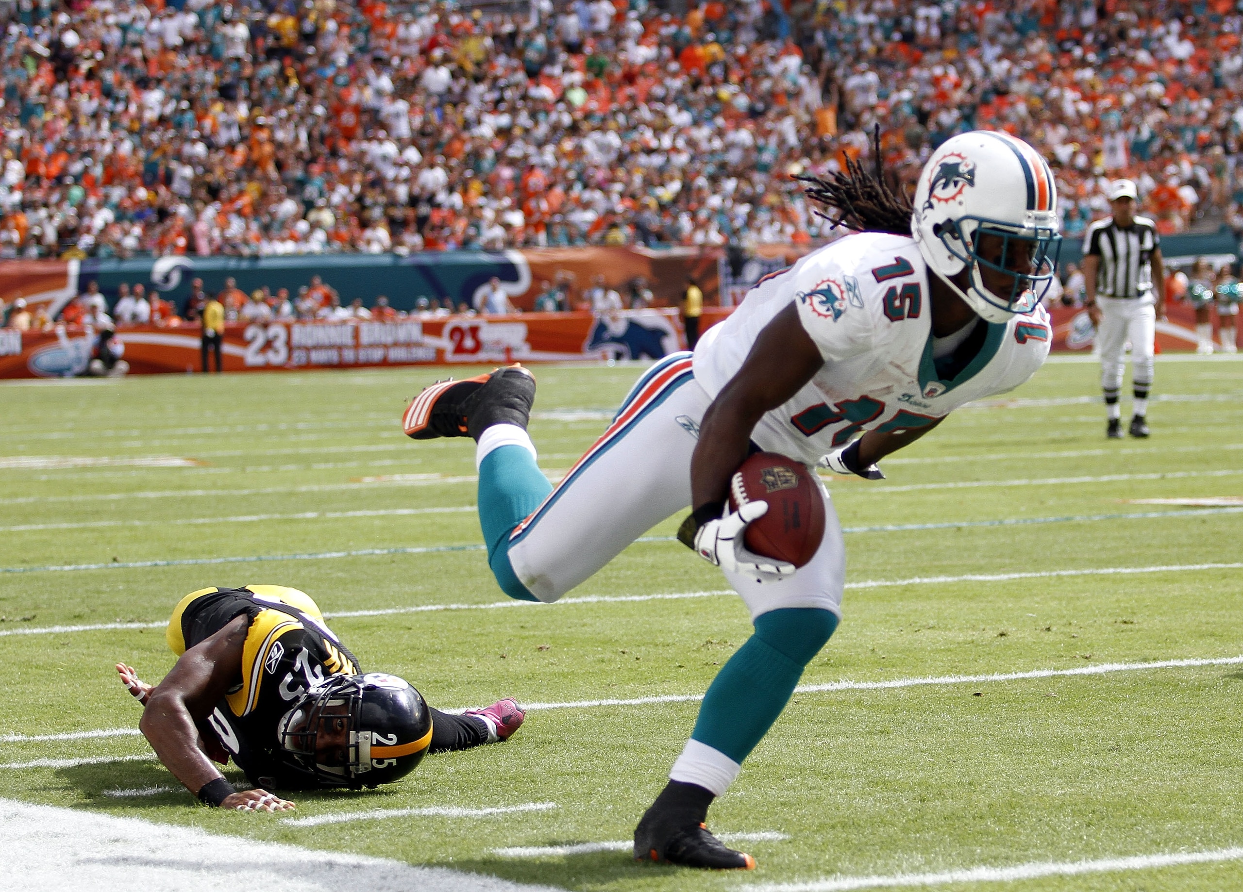 MIAMI - OCTOBER 24: Receiver Davone Bess #15 scores a touchdown against linebacker Lawrence Timmons #94 of the Pittsburgh Steelers at Sun Life Stadium on October 24, 2010 in Miami, Florida. (Photo by Marc Serota/Getty Images) MIAMI - OCTOBER 24: Receiver Davone Bess #15 scores a touchdown against linebacker Lawrence Timmons #94 of the Pittsburgh Steelers at Sun Life Stadium on October 24, 2010 in Miami, Florida. (Photo by Marc Serota/Getty Images)