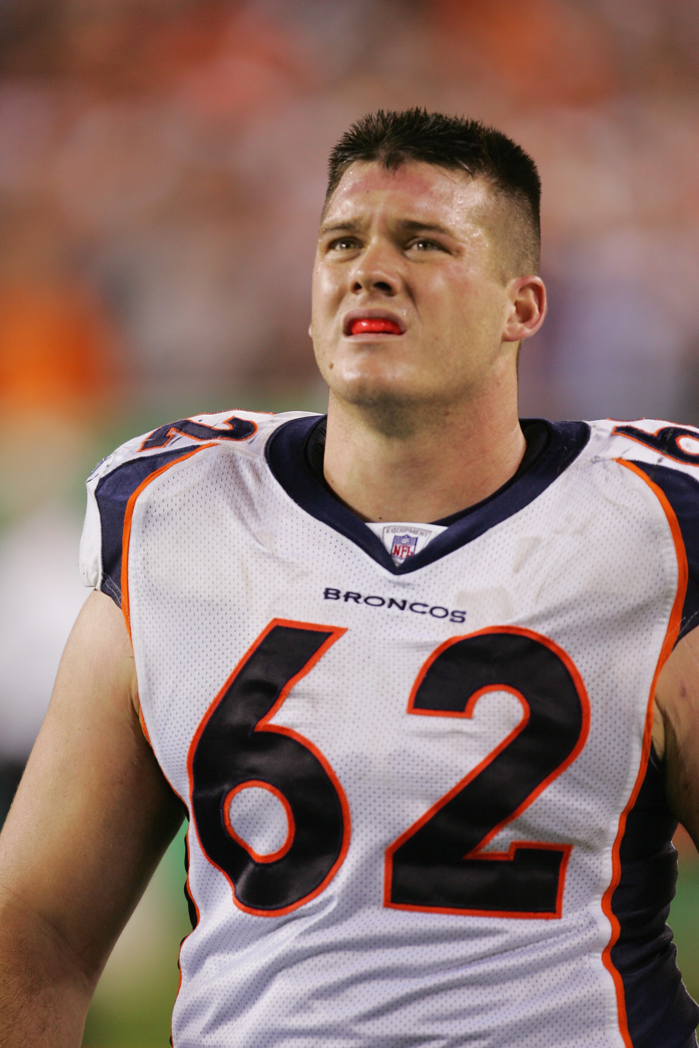 CINCINNATI - OCTOBER 25:  Dan Neil #62 of the Denver Broncos looks on during the game against the Cincinnati Bengals on October 25, 2004 at Paul Brown Stadium in Cincinnati, Ohio. The Bengals defeated the Broncos 23-10. (Photo by Ronald Martinez/Getty Ima
