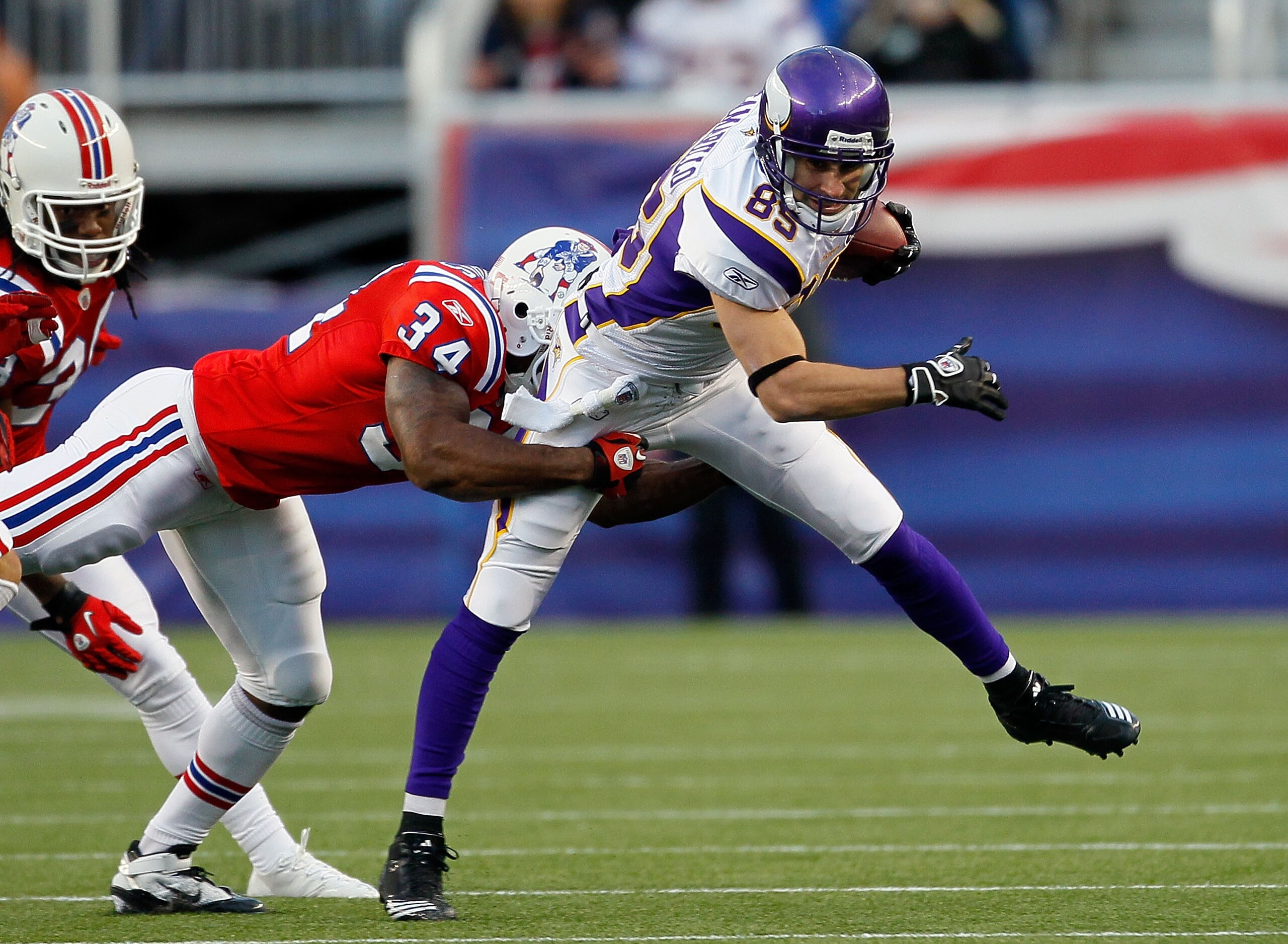FOXBORO, MA - OCTOBER 31:  Greg Camarillo #85 of the Minnesota Vikings is stopped by Sammy Morris #34 of the New England Patriots at Gillette Stadium on October 31, 2010 in Foxboro, Massachusetts. (Photo by Jim Rogash/Getty Images)