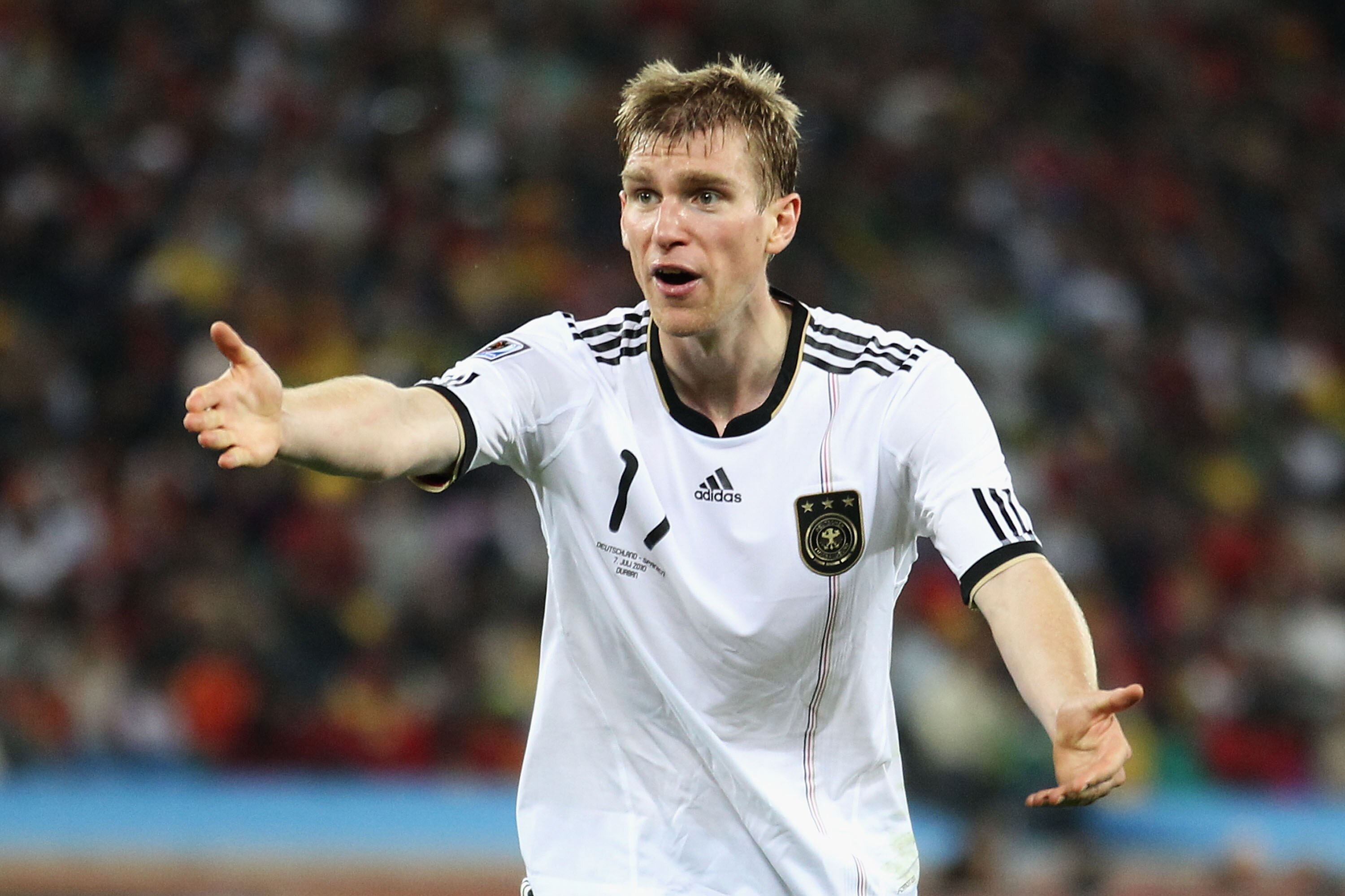 DURBAN, SOUTH AFRICA - JULY 07: Per Mertesacker of Germany gestures during the 2010 FIFA World Cup South Africa Semi Final match between Germany and Spain at Durban Stadium on July 7, 2010 in Durban, South Africa.  (Photo by Joern Pollex/Getty Images)