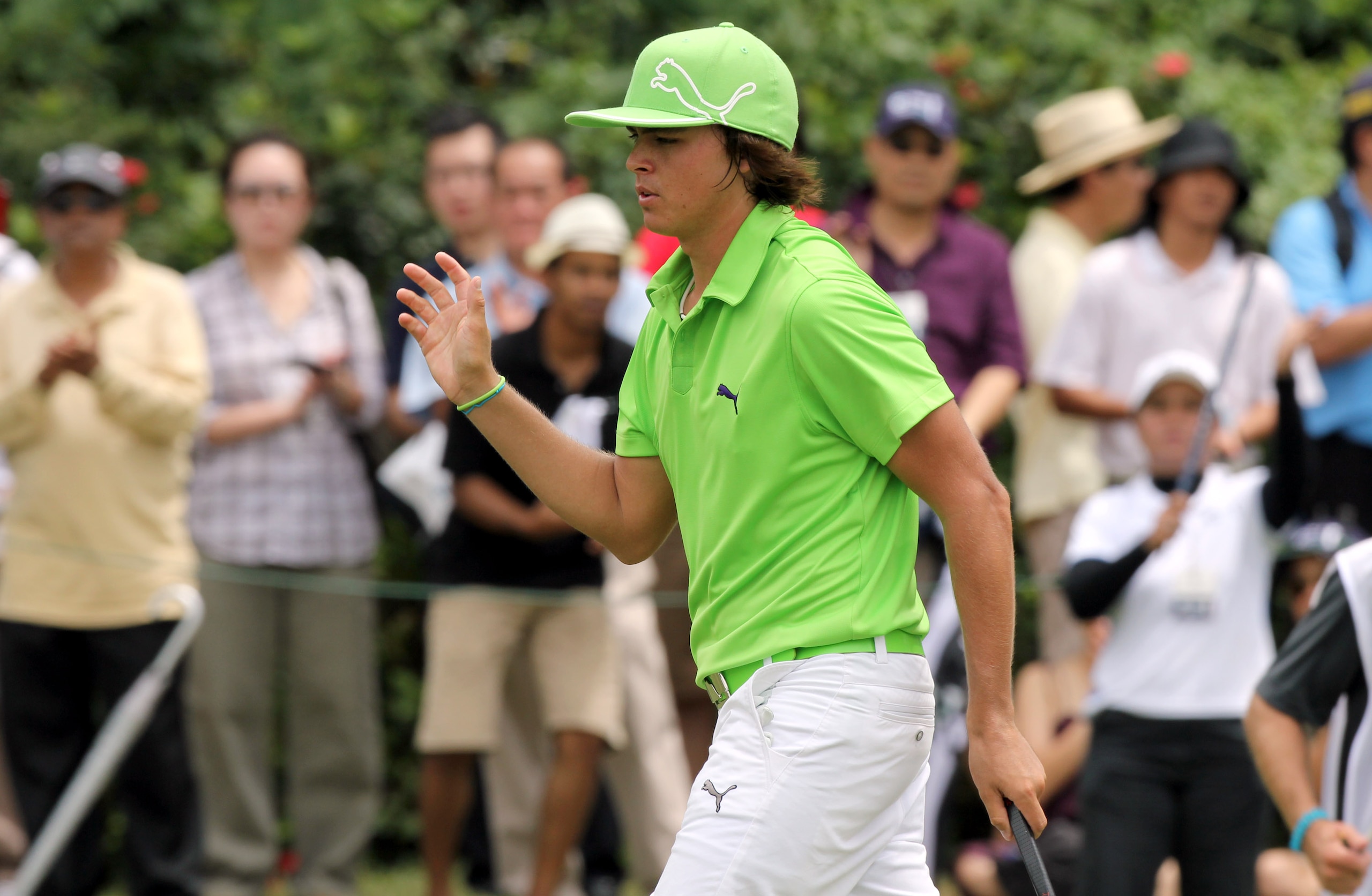 KUALA LUMPUR, MALAYSIA - OCTOBER 30: Rickie Fowler of USA acknowledges the crowd on the th hole during day three of the CIMB Asia Pacific Classic at The MINES Resort & Golf Club on October 30, 2010 in Kuala Lumpur, Malaysia. (Photo by Stanley Chou/Getty I