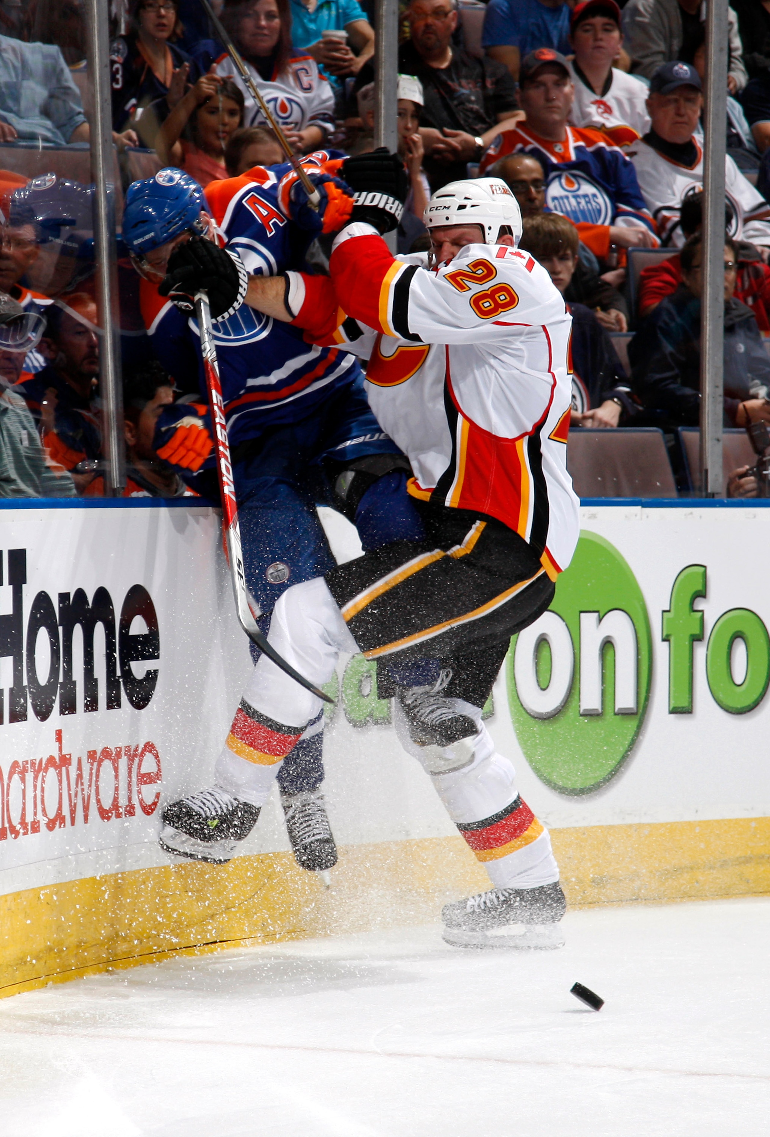EDMONTON, CANADA - OCTOBER 7: Robyn Regehr #28 of the Calgary Flames checks Ales Hemsky #83 of the Edmonton Oilers in first-period action at Rexall Place October 7, 2010 in Edmonton, Alberta, Canada. (Photo by Dale MacMillan/Getty Images) EDMONTON, CANADA - OCTOBER 7: Robyn Regehr #28 of the Calgary Flames checks Ales Hemsky #83 of the Edmonton Oilers in first-period action at Rexall Place October 7, 2010 in Edmonton, Alberta, Canada. (Photo by Dale MacMillan/Getty Images)