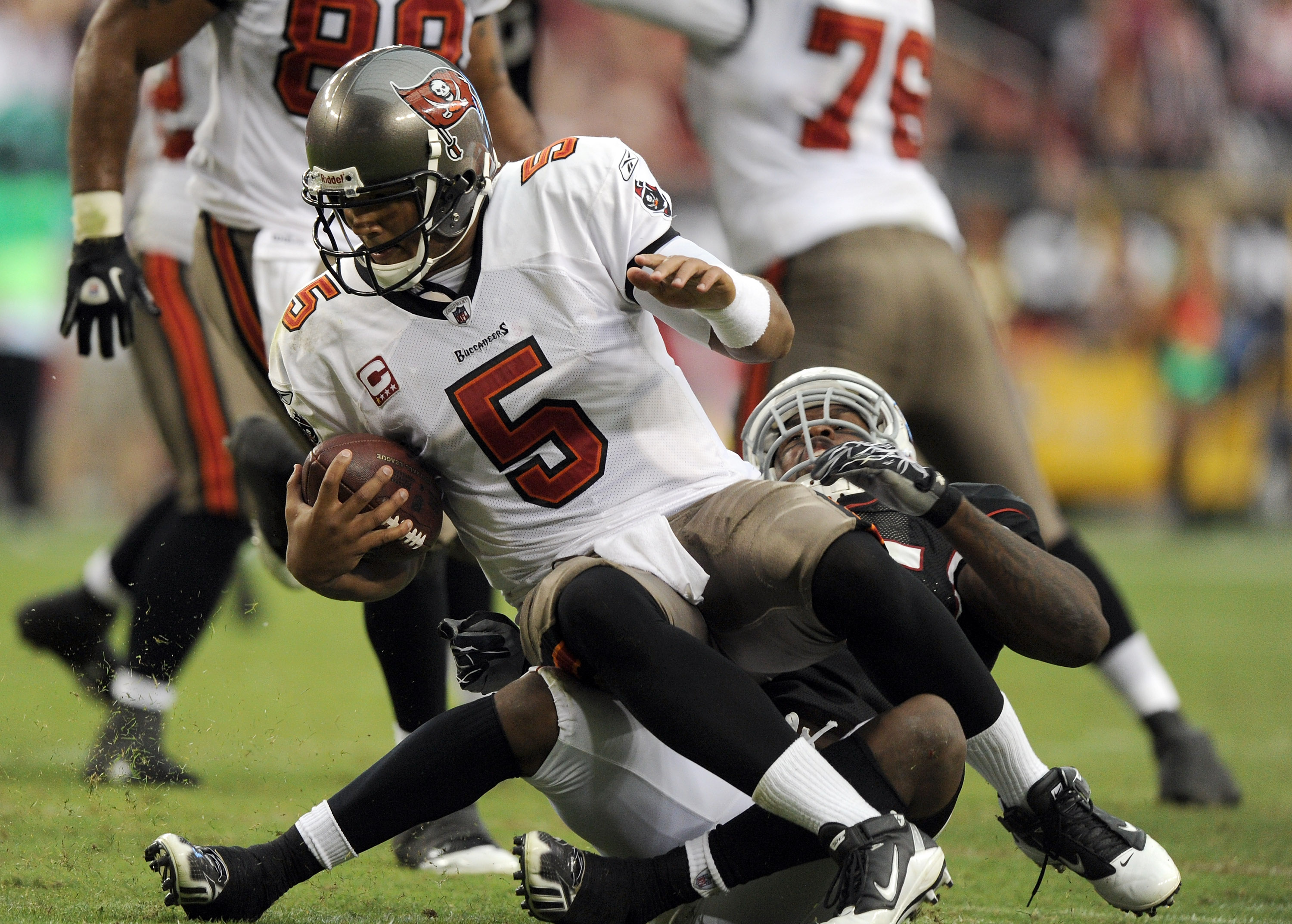 GLENDALE, AZ - OCTOBER 31:  Josh Freeman #5 of the Tampa Bay Buccaneers is sacked by Joey Porter #55 of the Arizona Cardinals at University of Phoenix Stadium on October 31, 2010 in Glendale, Arizona.  (Photo by Harry How/Getty Images)
