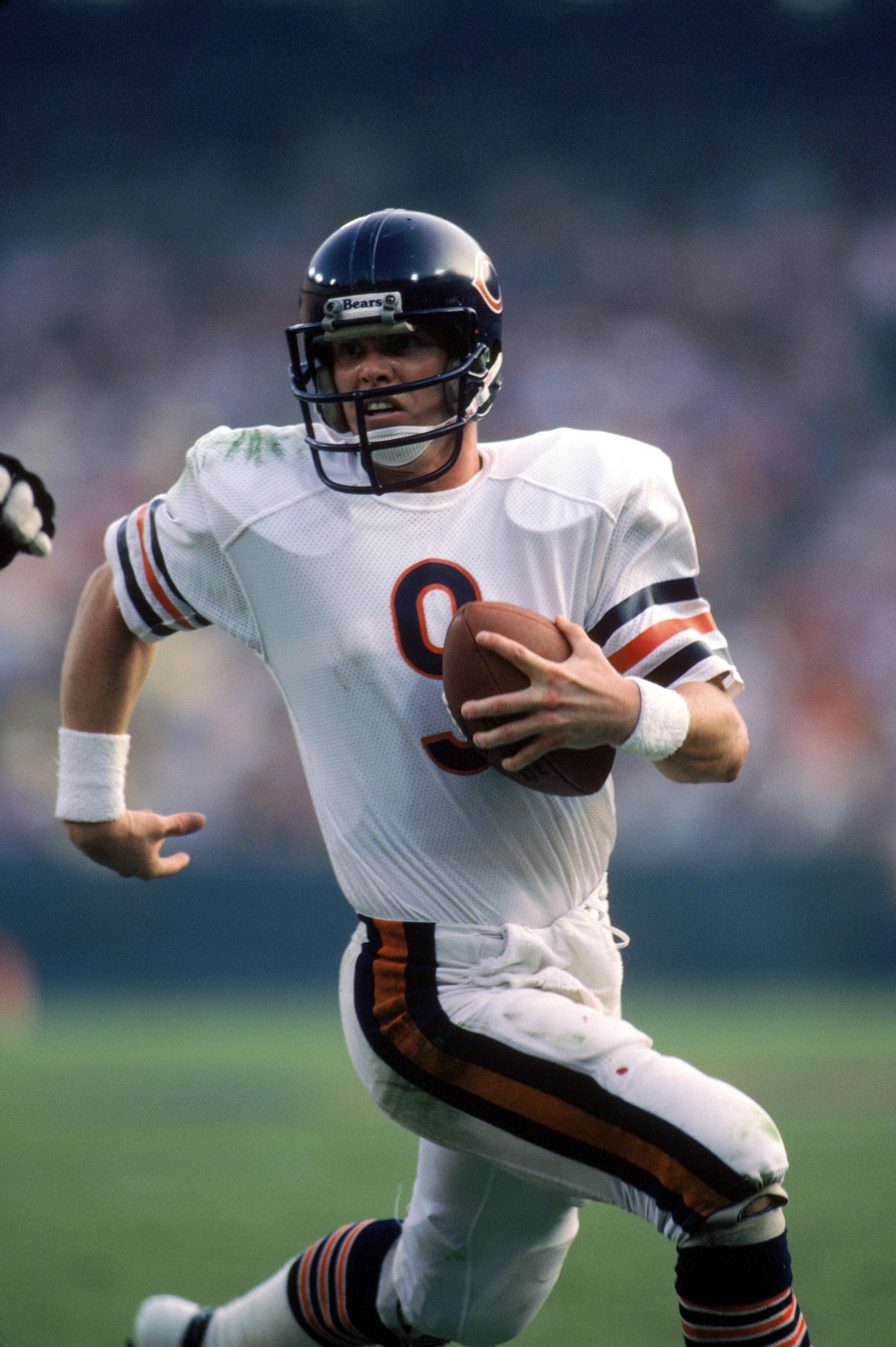 ANAHEIM, CA - NOVEMBER 6:  Quarterback Jim McMahon #9 of the Chicago Bears runs with the ball during a game against the Los Angeles Rams at Anaheim Stadium on November 6, 1983 in Anaheim, California.   The Rams won 21-14.  (Photo by George Rose/Getty Imag