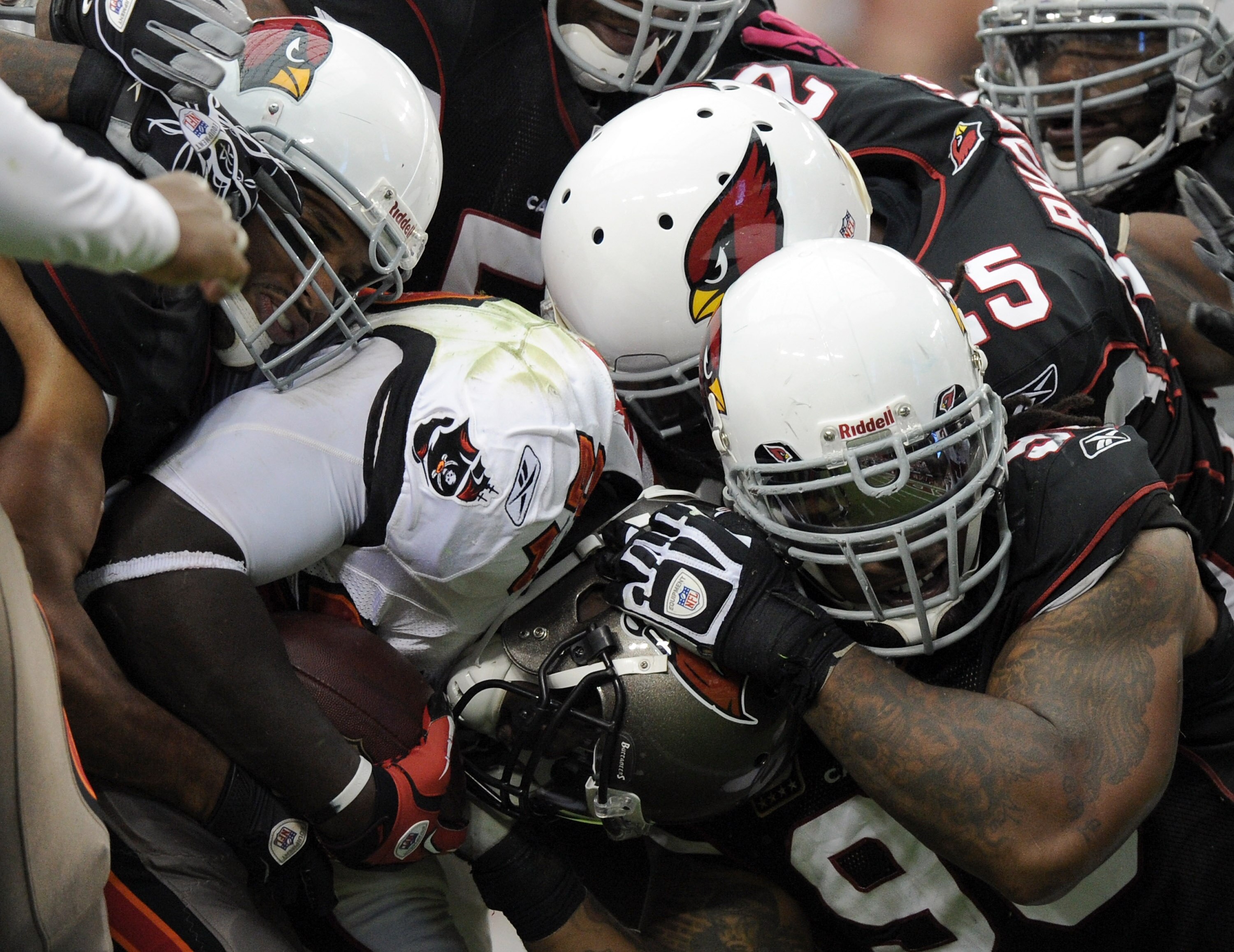 GLENDALE, AZ - OCTOBER 31:  Gabe Watson #98 of the Arizona Cardinals tackles Michael Adams #27 at University of Phoenix Stadium on October 31, 2010 in Glendale, Arizona.  (Photo by Harry How/Getty Images)