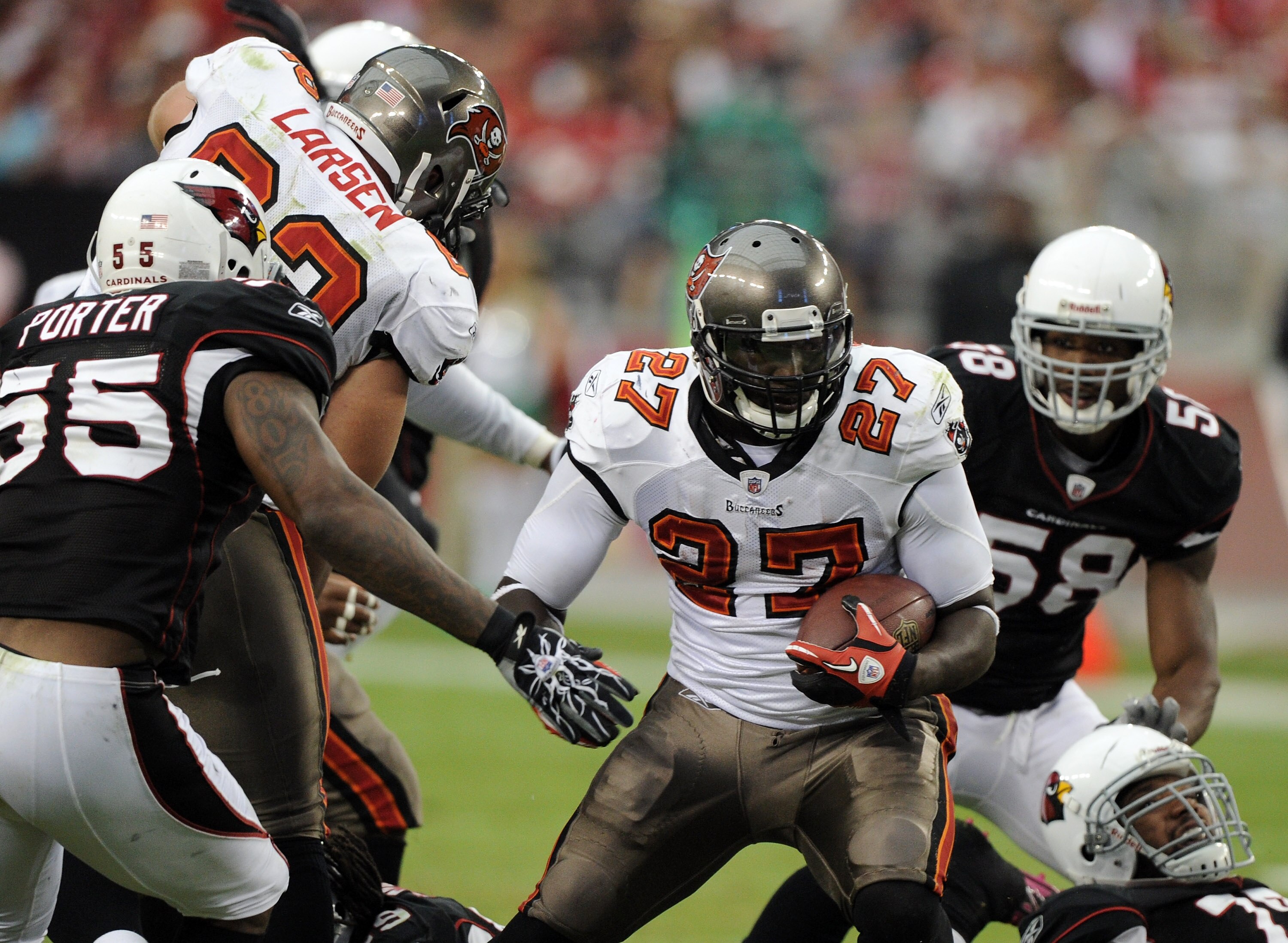 GLENDALE, AZ - OCTOBER 31:  LaGarrette Blount #27 of the Tampa Bay Buccaneers cuts away from Joey Porter #55 of the Arizona Cardinals at University of Phoenix Stadium on October 31, 2010 in Glendale, Arizona.  (Photo by Harry How/Getty Images)