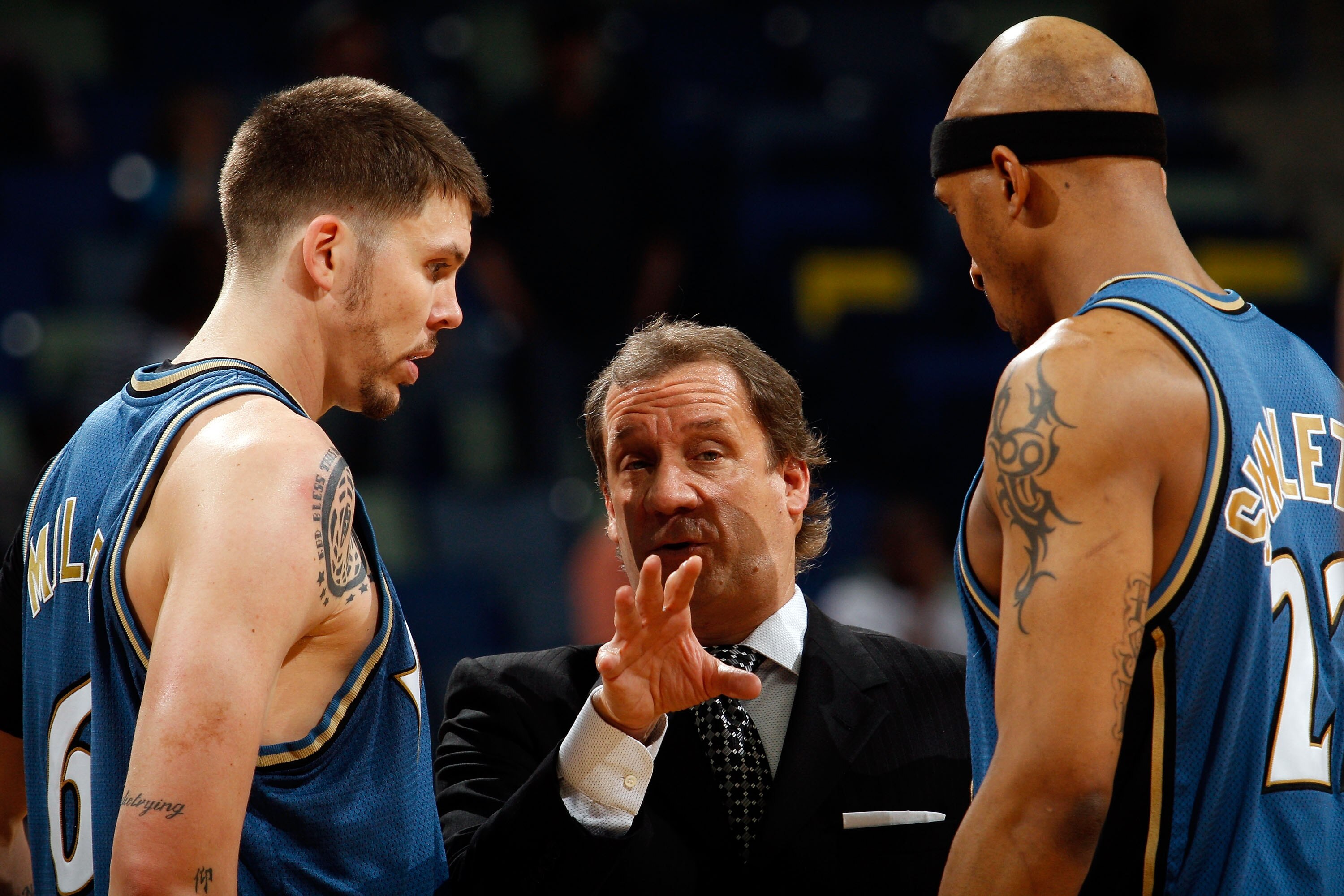 NEW ORLEANS - MARCH 31:  Mike Miller #6, head coach Flip Saunders and James Singleton #22 of the Washington Wizards talk during a timeout against the New Orleans Hornets at New Orleans Arena on March 31, 2010 in New Orleans, Louisiana.  The Wizards defeat