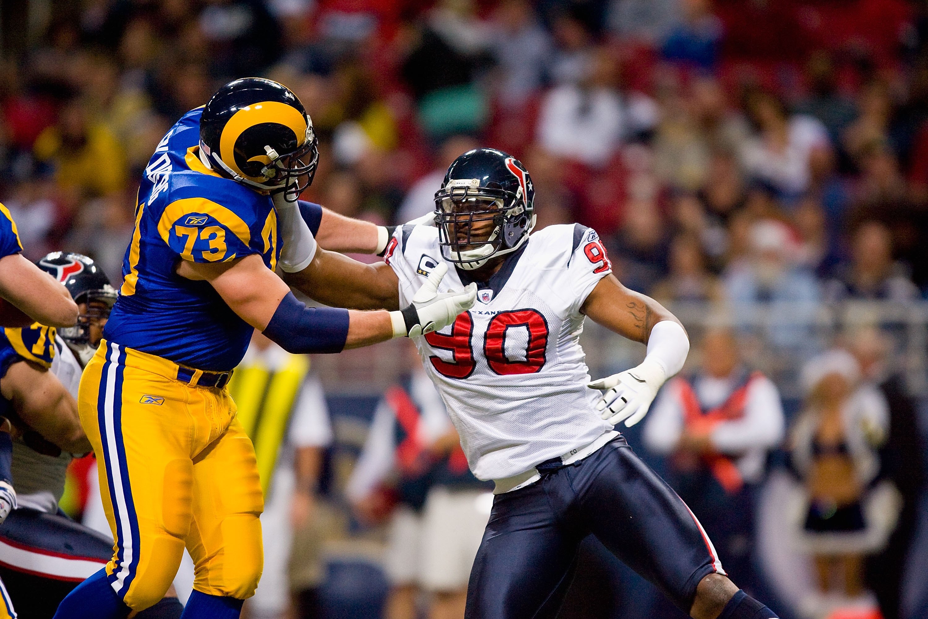 ST. LOUIS - DECEMBER 20:  Mario Williams #90 of the Houston Texans rushes against Adam Goldberg #73 of the St. Louis Rams at Edward Jones Dome on December 20, 2009 in St. Louis, Missouri.  (Photo by Dilip Vishwanat/Getty Images)