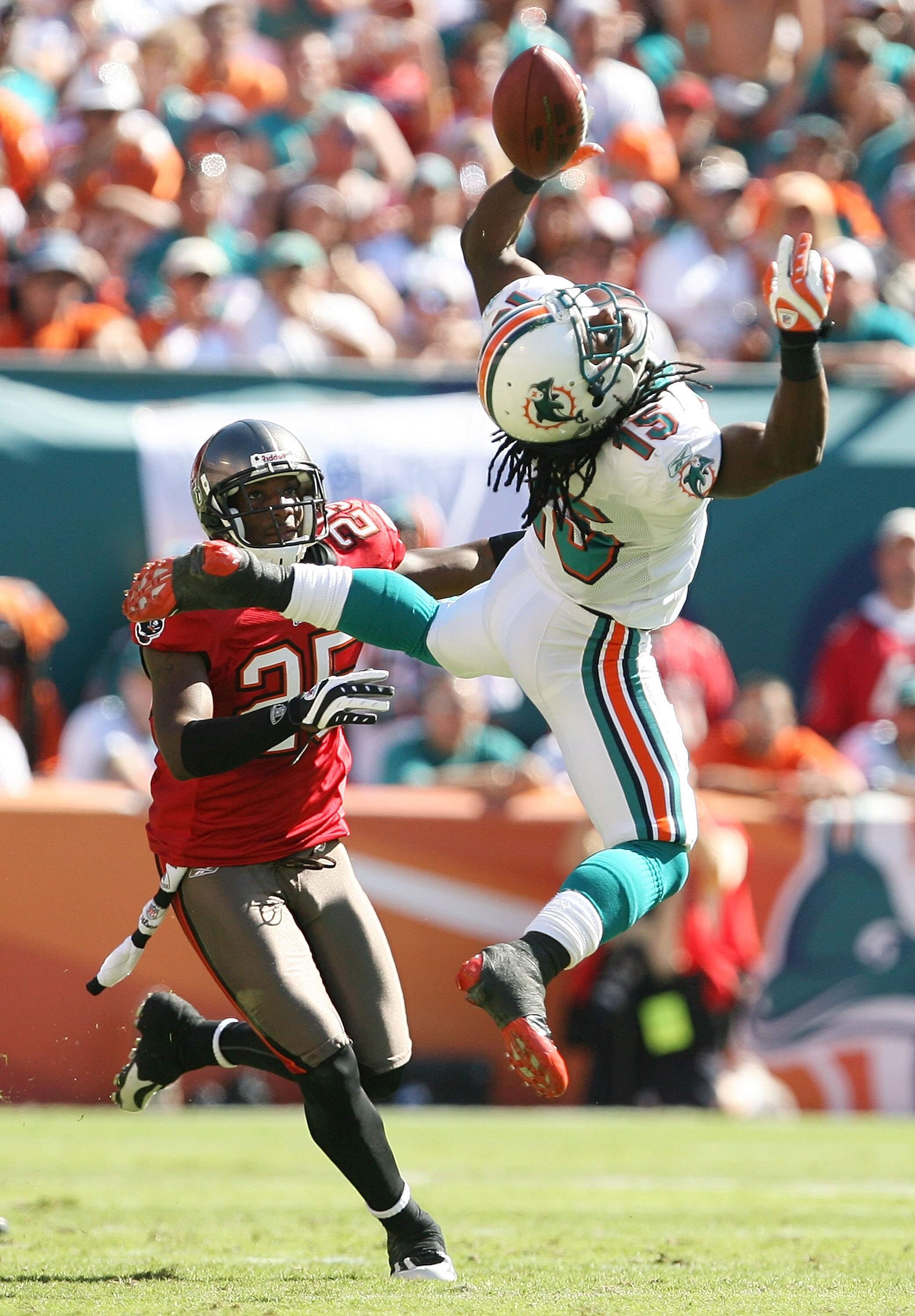 MIAMI GARDENS, FL - NOVEMBER 15:  Cornerback Aqub Talib #25 of the Tampa Bay Buccaneers watches as a pass attempt skips off the fingers of wide receiver Devone Bess #15 of the Miami Dolphins at Land Shark Stadium on November 15, 2009 in Miami Gardens, Flo