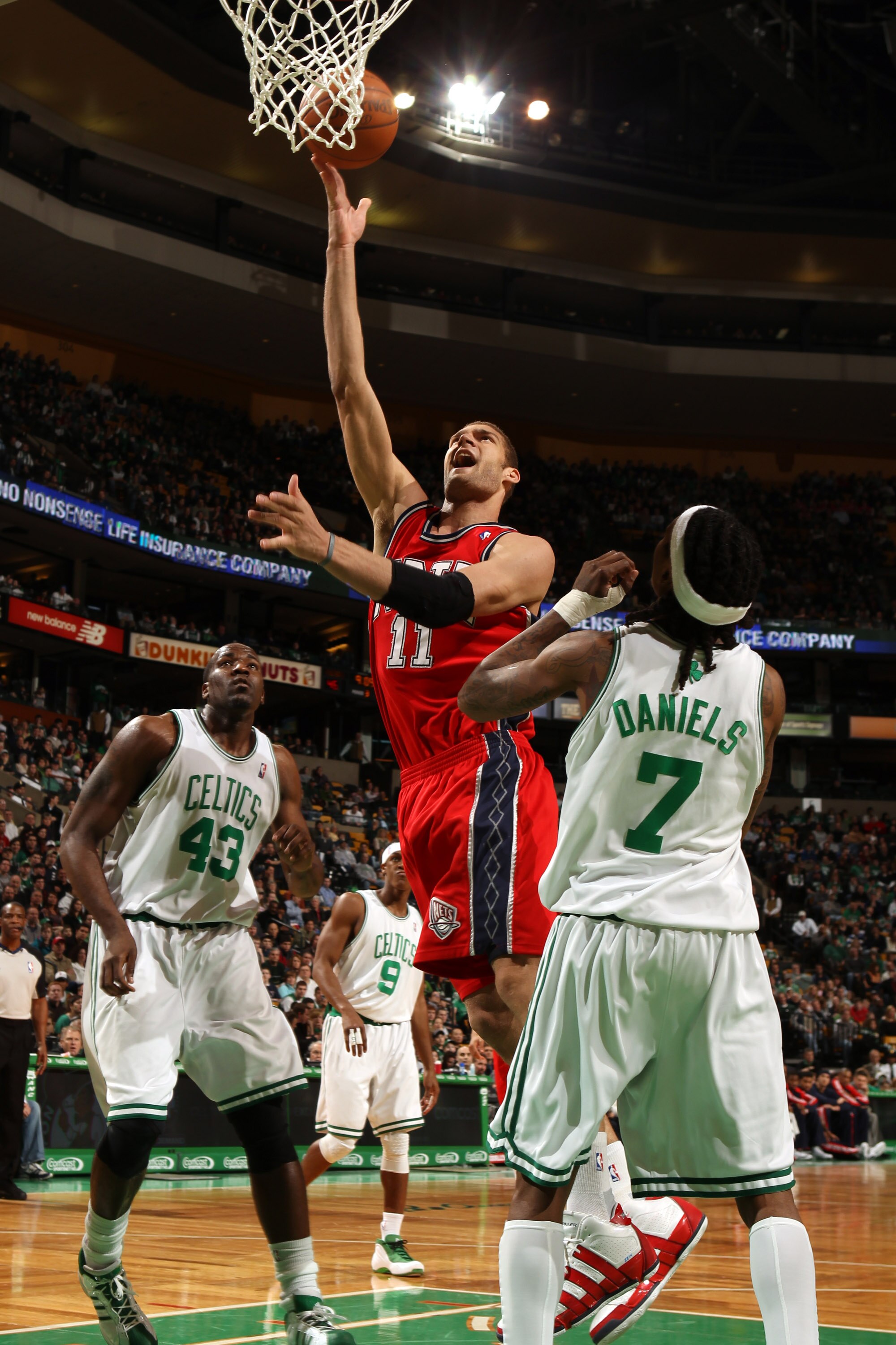 BOSTON - FEBRUARY 27:  Brook Lopez #11 of the New Jersey Nets goes up for a shot in the lane against Marquis Daniels #7 of the Boston Celtics on February 27, 2010 at TD Garden in Boston, Massachusetts.  NOTE TO USER: User expressly acknowledges and agrees