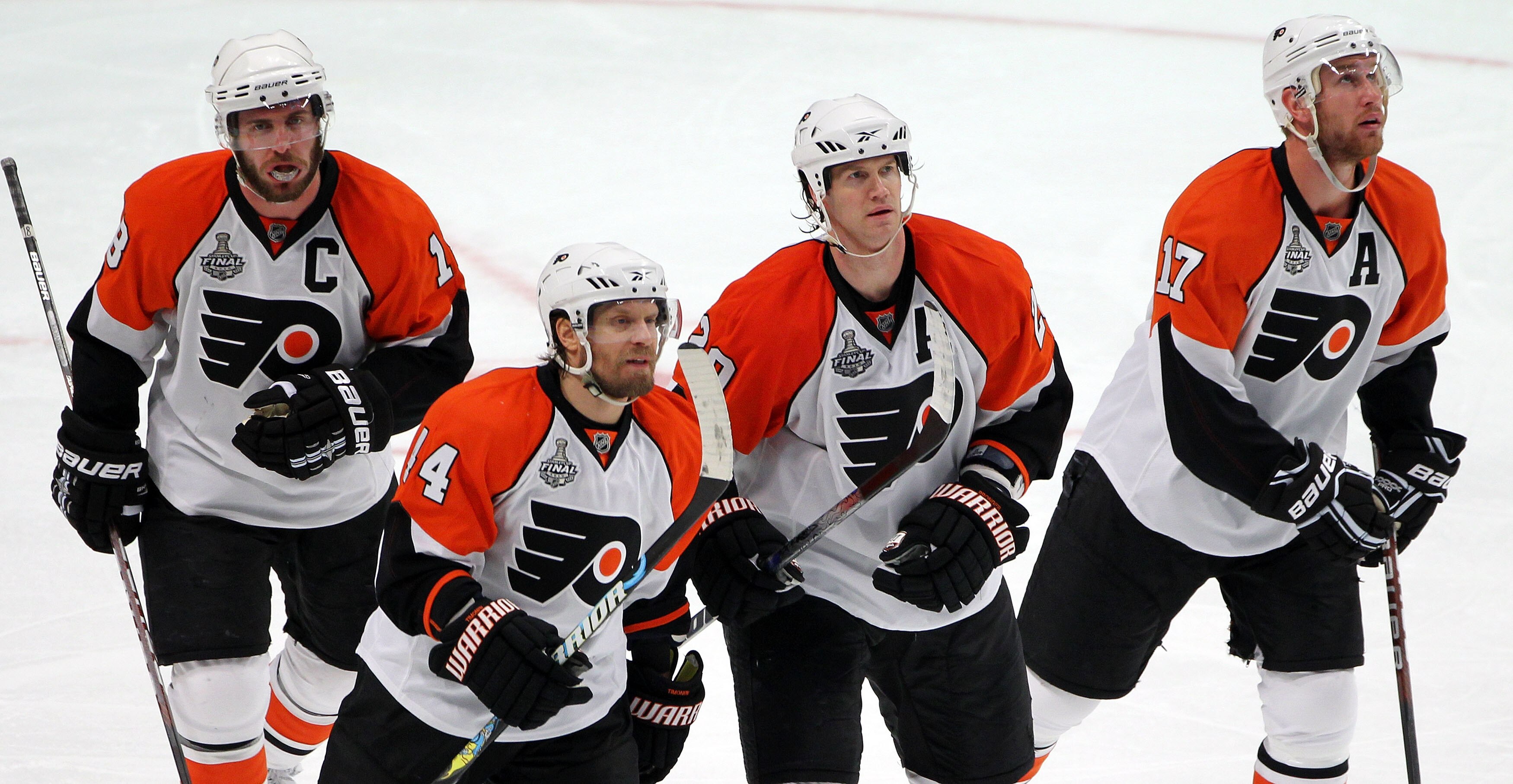 CHICAGO - MAY 31:  Mike Richards #18, Kimmo Timonen #44, Chris Pronger #20 and Jeff Carter #17 of the Philadelphia Flyers skate off the ice while playing against the Chicago Blackhawks in Game Two of the 2010 NHL Stanley Cup Final at the United Center on