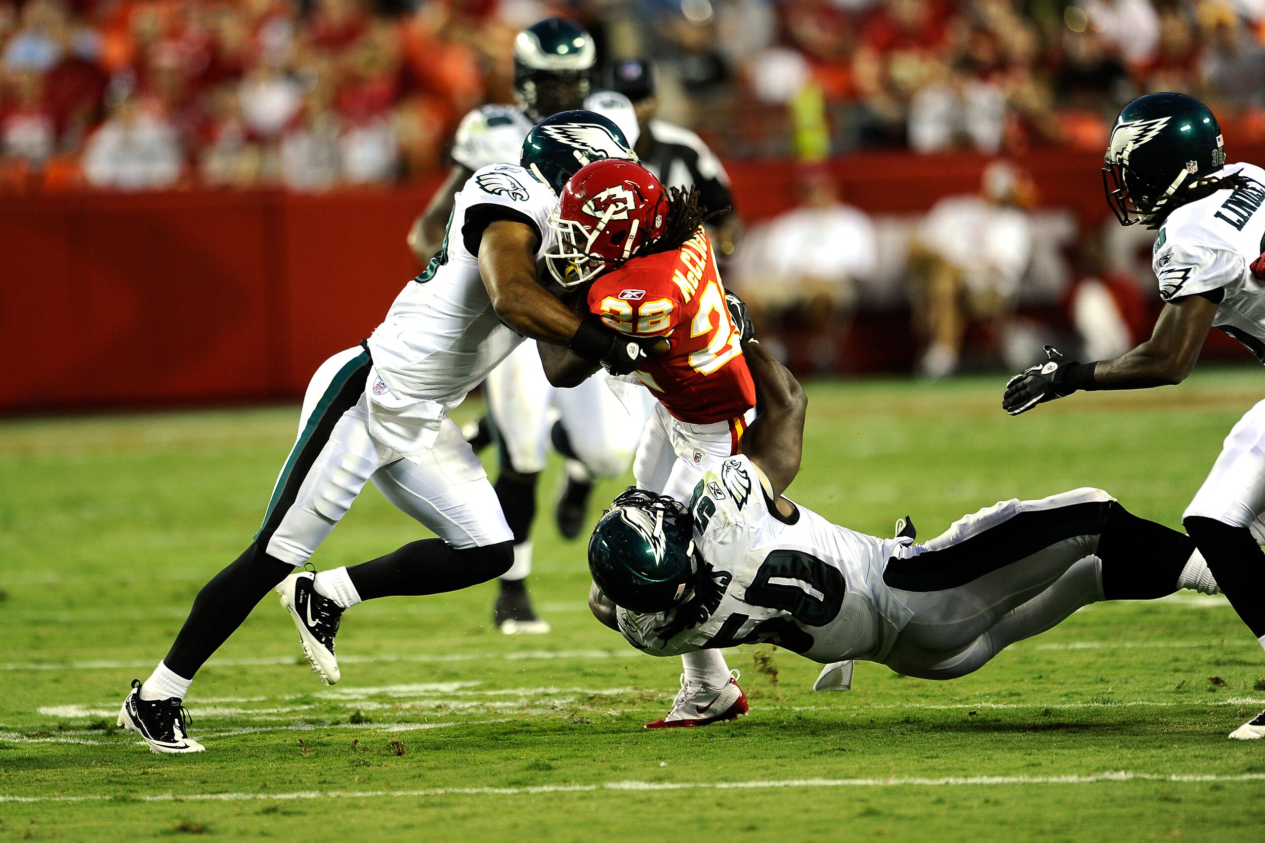 KANSAS CITY, MO - AUGUST 27: Dexter McCluster #22 of the Kansas City Chiefs is stopped by Nate Allen #29 and Ernie Sims #50 of the Philadelphia Eagles during a preseason game at Arrowhead Stadium on August 27, 2010 in Kansas City, Missouri. (Photo by G. KANSAS CITY, MO - AUGUST 27: Dexter McCluster #22 of the Kansas City Chiefs is stopped by Nate Allen #29 and Ernie Sims #50 of the Philadelphia Eagles during a preseason game at Arrowhead Stadium on August 27, 2010 in Kansas City, Missouri. (Photo by G.