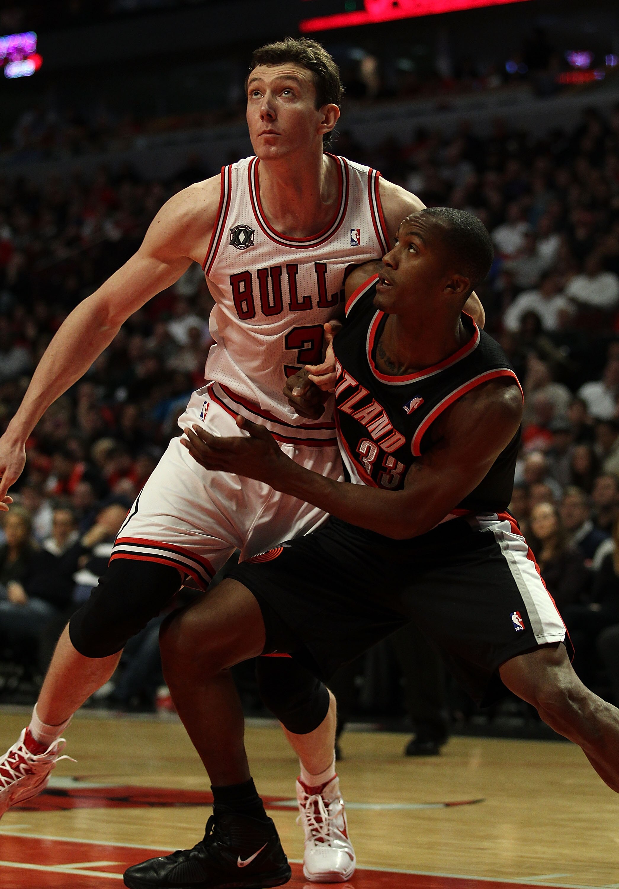 CHICAGO - NOVEMBER 01: Omer Asik #3 of the Chicago Bulls battles for rebound position with Dante Cunningham #33 of the Portland Trail Blazers at the United Center on November 1, 2010 in Chicago, Illinois. The Bulls defeated the Trail Blazers 110-98. NOTE