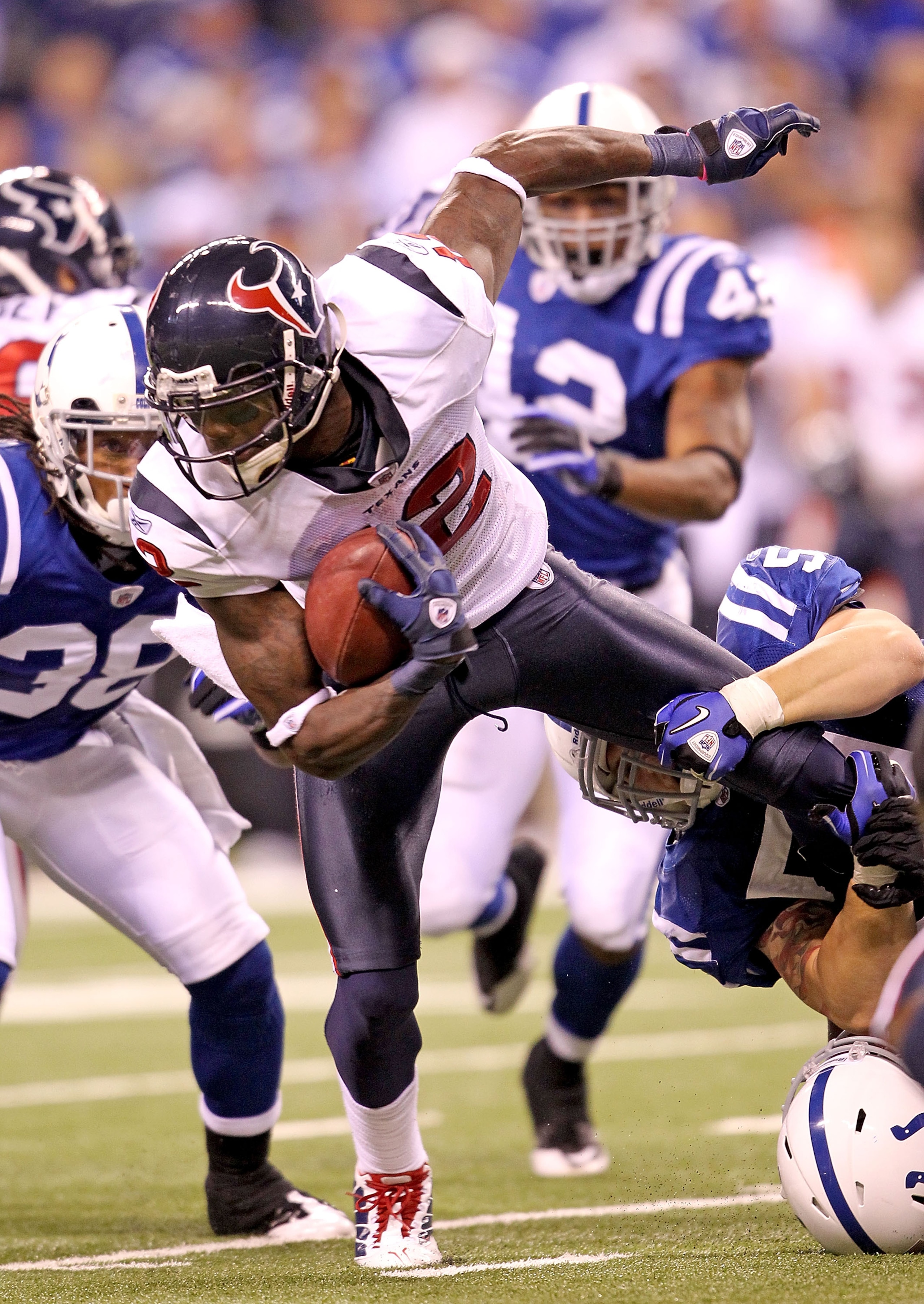 INDIANAPOLIS - NOVEMBER 01:  Jacoby Jones #12 of Houston Texans is tackled during the NFL game against the Indianapolis Colts at Lucas Oil Stadium on November 1, 2010 in Indianapolis, Indiana.  (Photo by Andy Lyons/Getty Images)