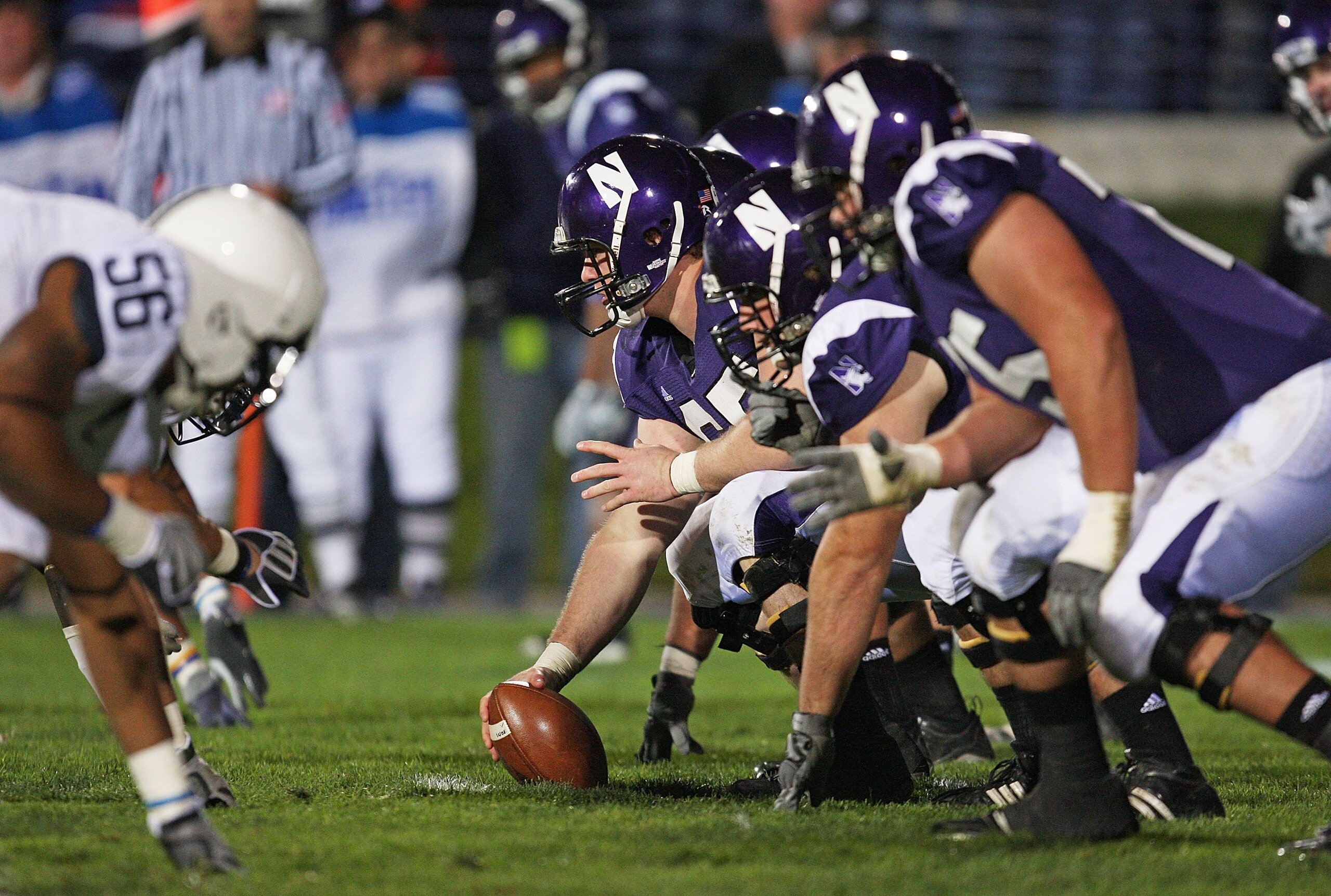 EVANSTON, IL - OCTOBER 31: Ben Burkett #65 of the Northwestern Wildcats prepares to snap the ball against the Penn State Nittany Lions at Ryan Field on October 31, 2009 in Evanston, Illinois. Penn State defeated Northwestern 34-13. (Photo by Jonathan Dani EVANSTON, IL - OCTOBER 31: Ben Burkett #65 of the Northwestern Wildcats prepares to snap the ball against the Penn State Nittany Lions at Ryan Field on October 31, 2009 in Evanston, Illinois. Penn State defeated Northwestern 34-13. (Photo by Jonathan Dani