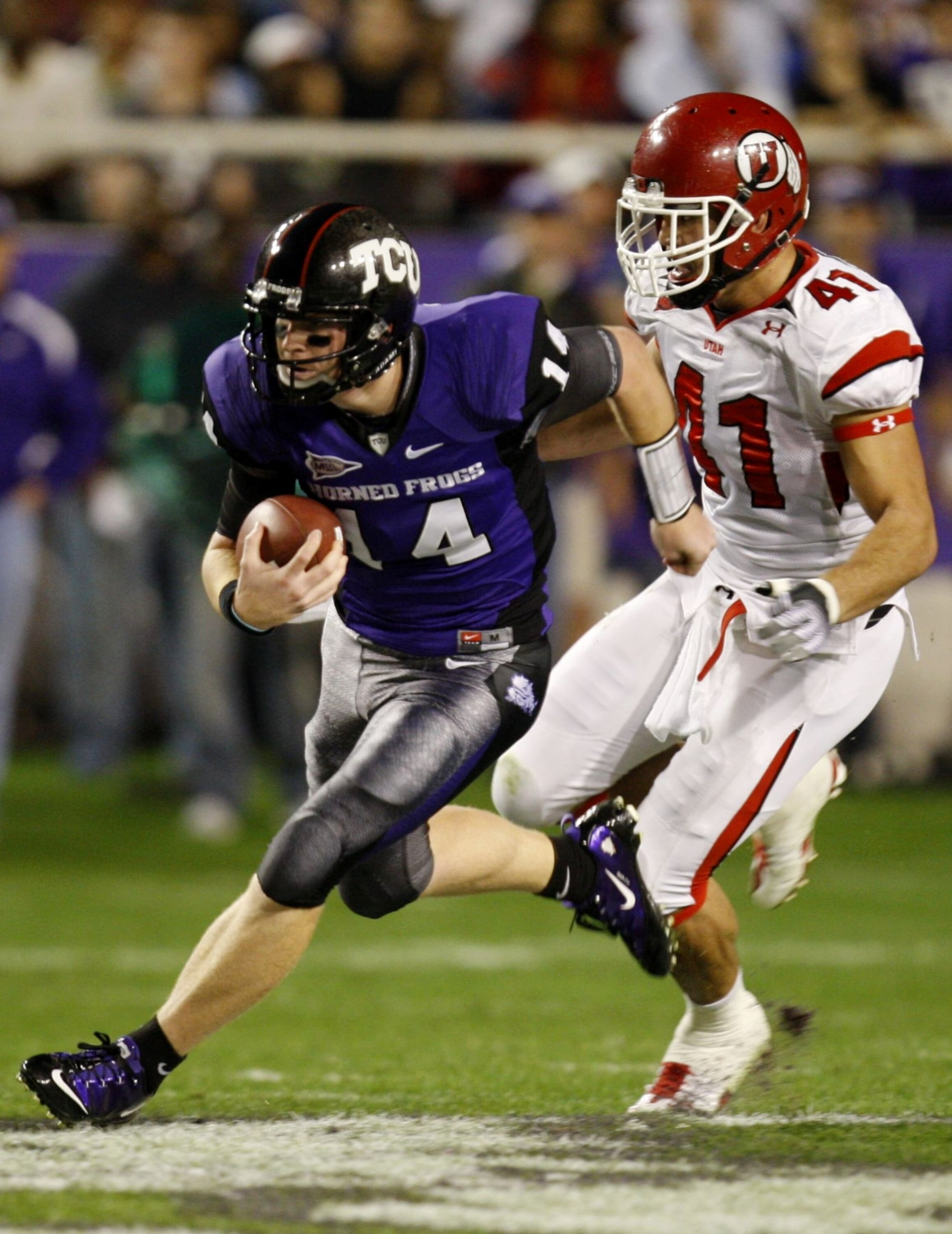 FORT WORTH, TX - NOVEMBER 14:  Quarterback Andy Dalton #14 of the TCU Horned Frogs runs with the ball in the first quarter against the Utah Utes at Amon G. Carter Stadium on November 14, 2009 in Fort Worth, Texas.  (Photo by Ronald Martinez/Getty Images)