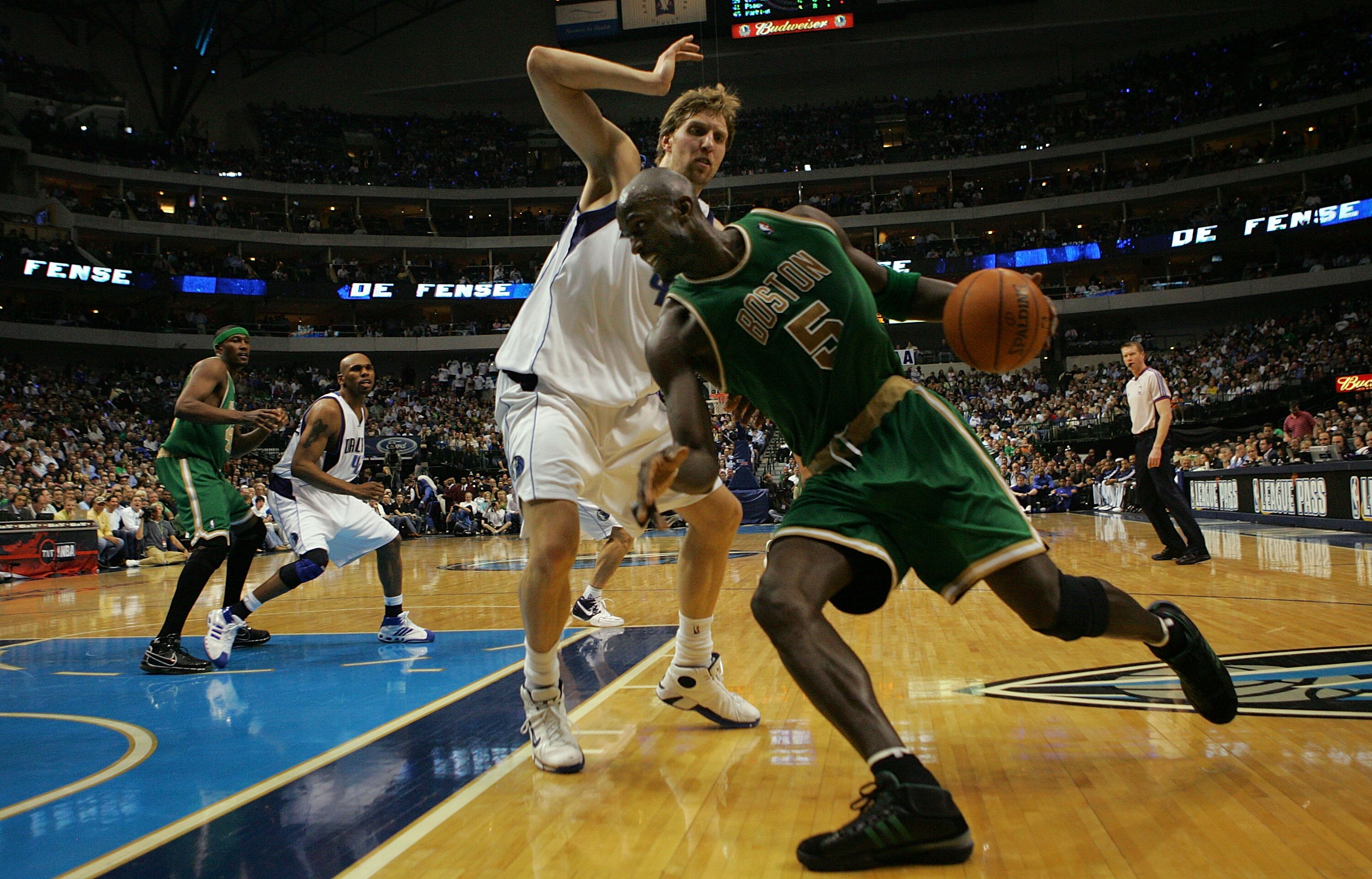 DALLAS - MARCH 20:  Kevin Garnett #5 of the Boston Celtics moves the ball against Dirk Nowitzki #41 of the Dallas Mavericks on March 20, 2008 at American Airlines Center in Dallas, Texas.  NOTE TO USER: User expressly acknowledges and agrees that, by down