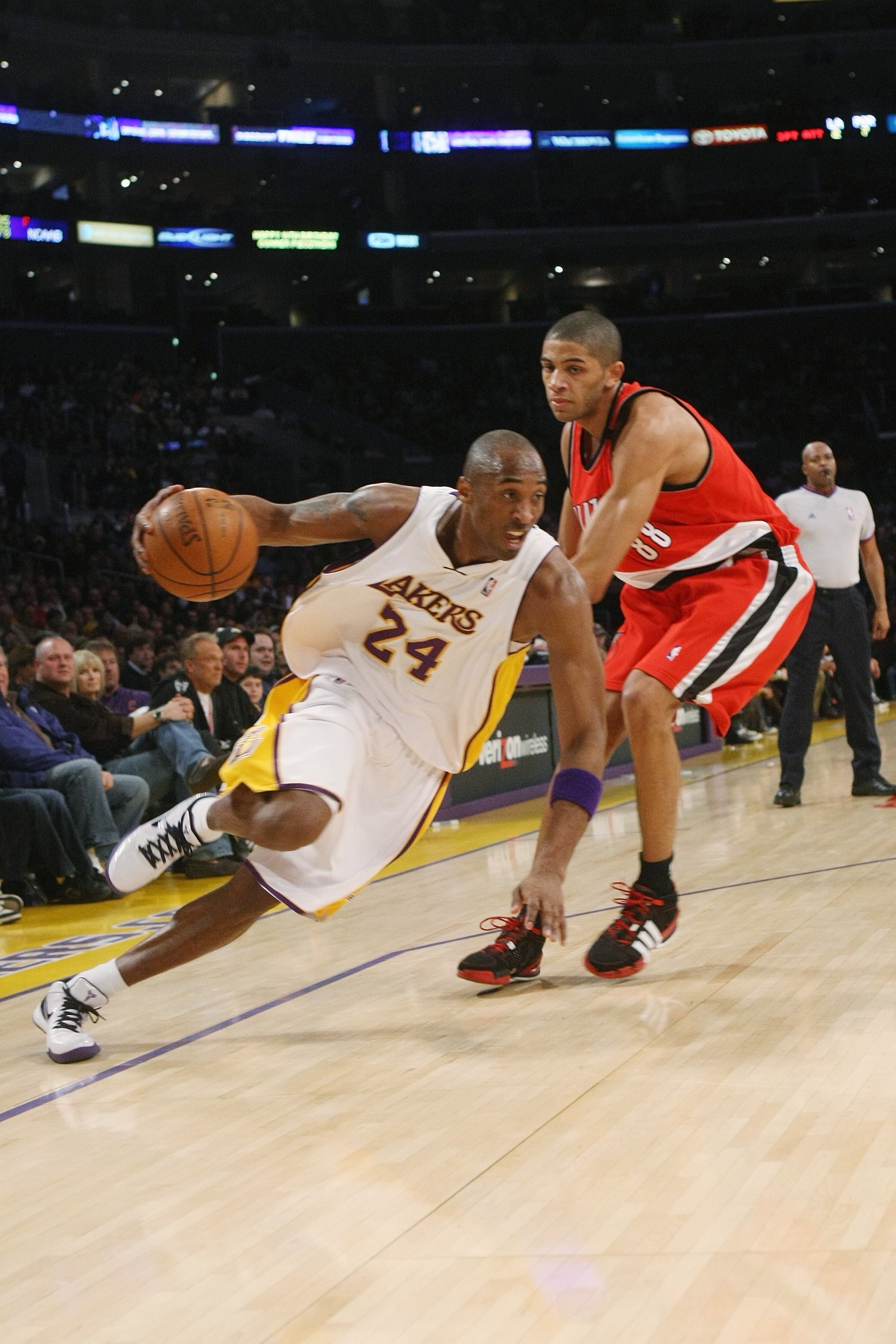 LOS ANGELES - JANUARY 4:  Kobe Bryant #24 of the Los Angeles Lakers drives against Nicolas Batum #88 of the Portland Trail Blazers on January 4, 2009 at Staples Center in Los Angeles, California.    NOTE TO USER: User expressly acknowledges and agrees tha