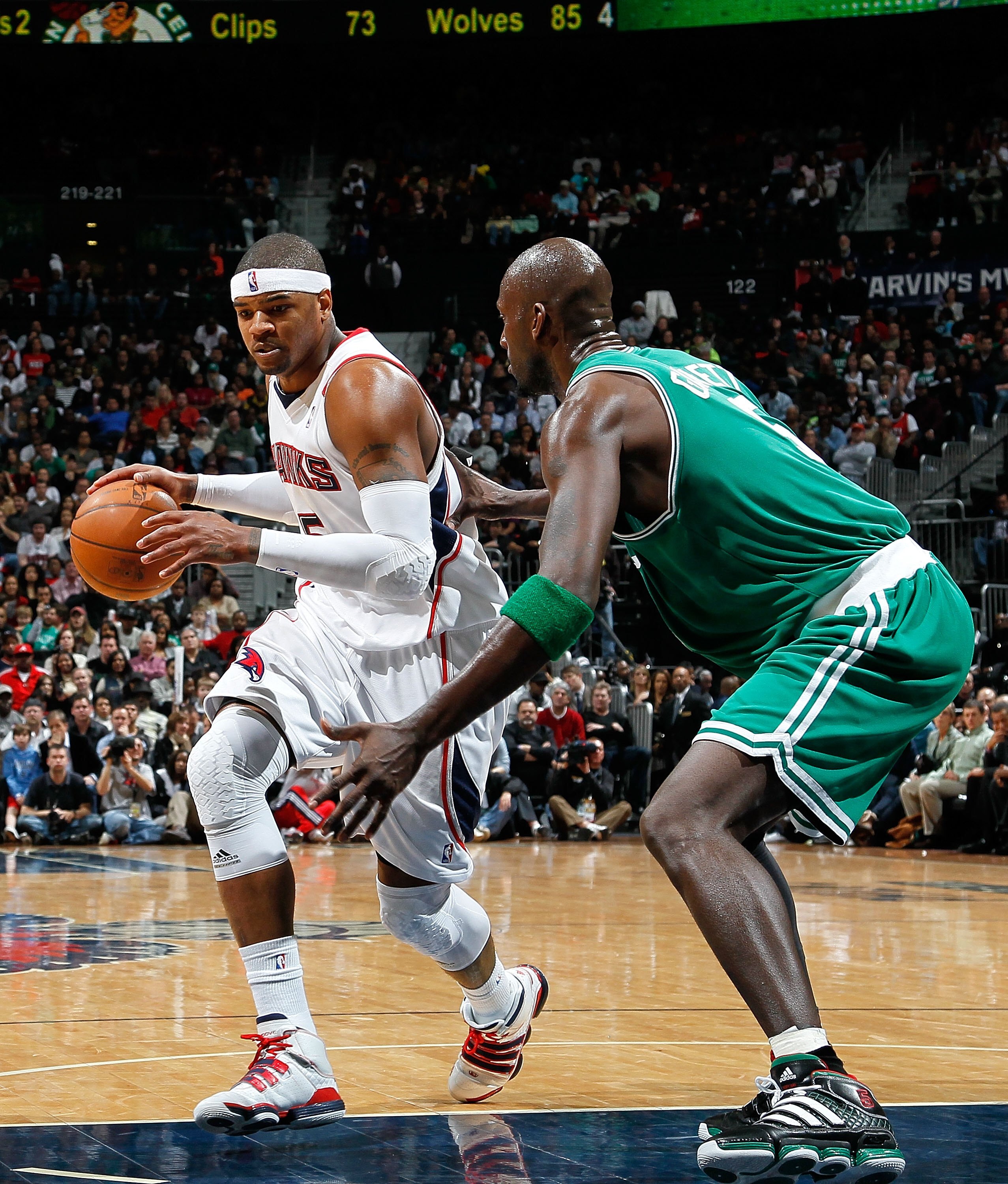 ATLANTA - JANUARY 29:  Kevin Garnett #5 of the Boston Celtics against Josh Smith #5 of the Atlanta Hawks at Philips Arena on January 29, 2010 in Atlanta, Georgia.  NOTE TO USER: User expressly acknowledges and agrees that, by downloading and/or using this