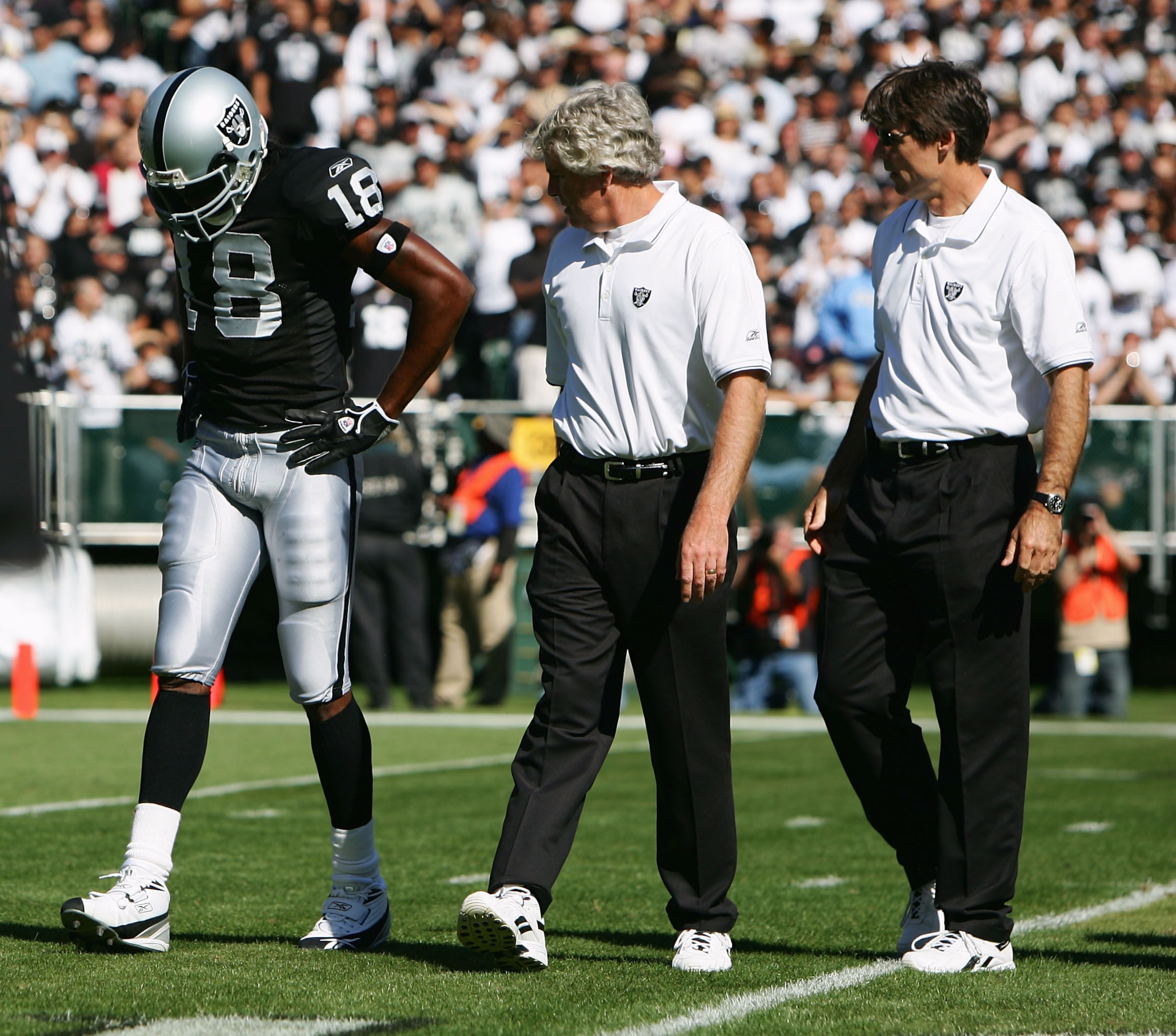 OAKLAND, CA - OCTOBER 16:  Wide receiver Randy Moss #18 of the Oakland Raiders comes off the field after sustaining an injury during the first quarter of the game against the San Diego Chargers at McAfee Coliseum on October 16, 2005 in Oakland, California