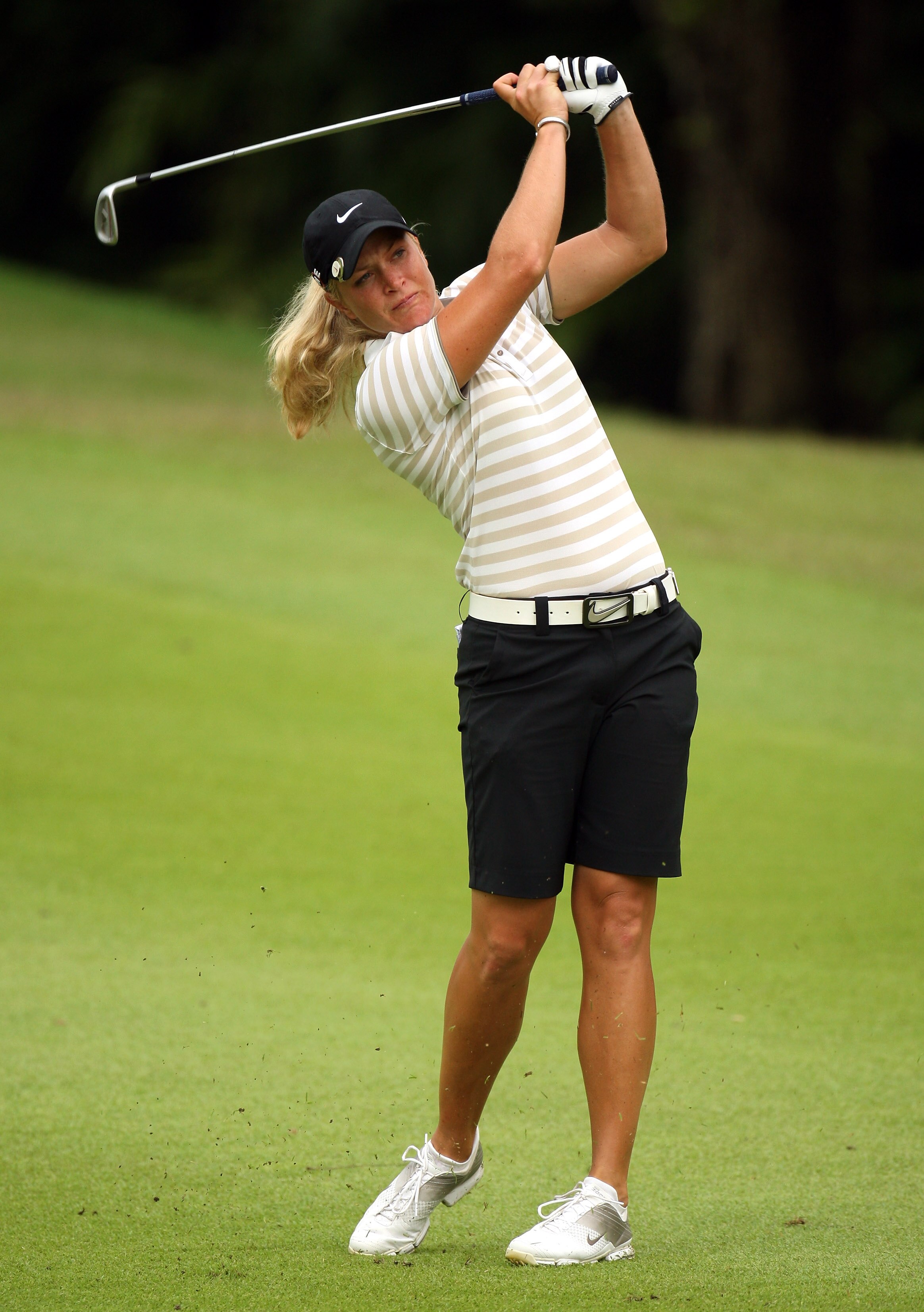 SINGAPORE - MARCH 07:  Suzann Petterson of Norway plays her second shot on the par four 4th hole during the third round of HSBC Women's Champions at the Tanah Merah Country Club on March 7, 2009 in Singapore.  (Photo by Ross Kinnaird/Getty Images)