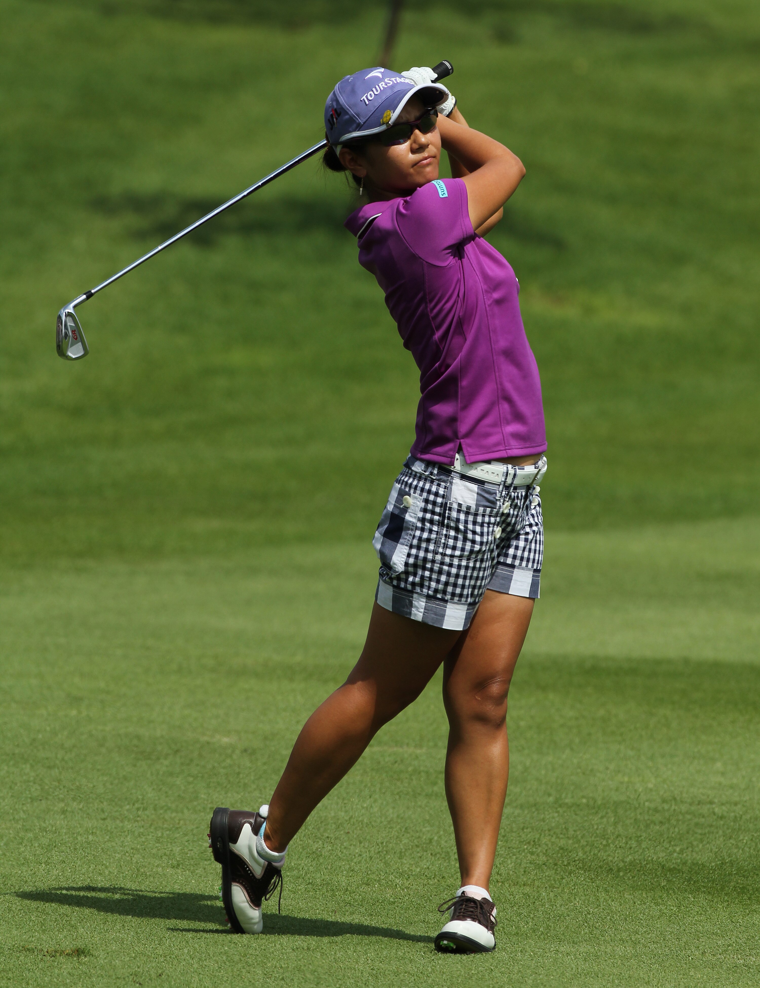KUALA LUMPUR, MALAYSIA - OCTOBER 22 : Al Miyazato of Japan watches her 2nd shot on the 1st hole of Korea Republic during Round One of the Sime Darby LPGA on October 22, 2010 at the Kuala Lumpur Golf and Country Club in Kuala Lumpur, Malaysia. (Photo by St