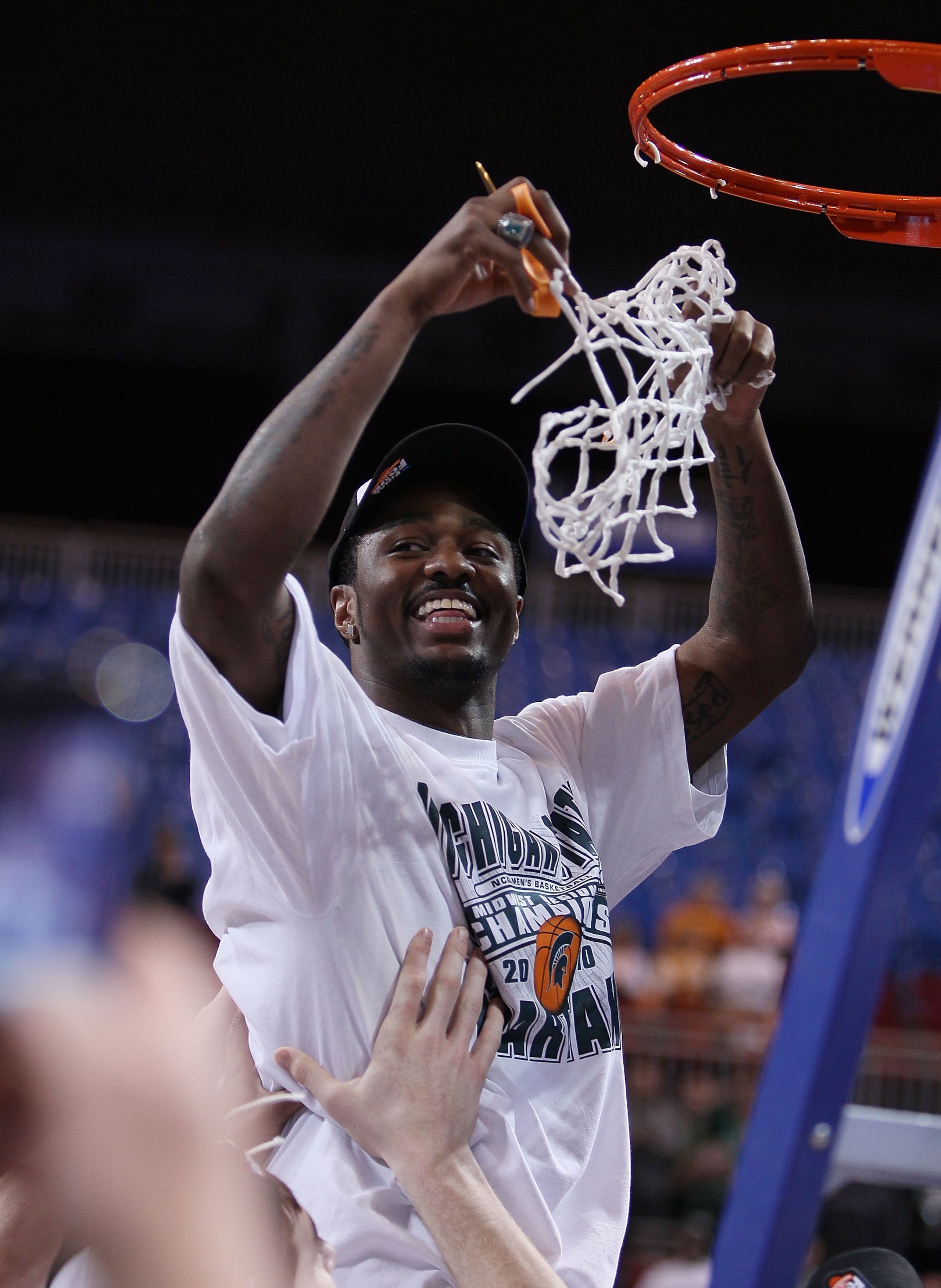 ST. LOUIS - MARCH 28:  :  :  Kalin Lucas #1 of the Michigan State Spartans is lifted by his teammates to cut the net during the midwest regional final of the 2010 NCAA men's basketball tournament at the Edward Jones Dome on March 28, 2010 in St. Louis, Mi