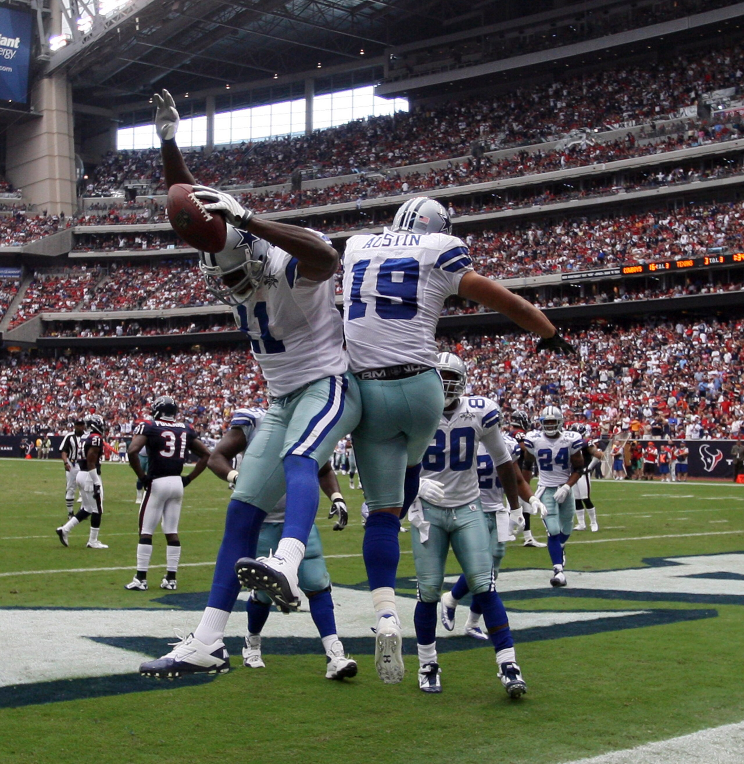 HOUSTON - SEPTEMBER 26: Wide receiver Roy Williams #11 and Miles Austin #11 celebrate after scoring on a 15 yard pass from Tony Romo in the third quarter at Reliant Stadium on September 26, 2010 in Houston, Texas. (Photo by Bob Levey/Getty Images) HOUSTON - SEPTEMBER 26: Wide receiver Roy Williams #11 and Miles Austin #11 celebrate after scoring on a 15 yard pass from Tony Romo in the third quarter at Reliant Stadium on September 26, 2010 in Houston, Texas. (Photo by Bob Levey/Getty Images)