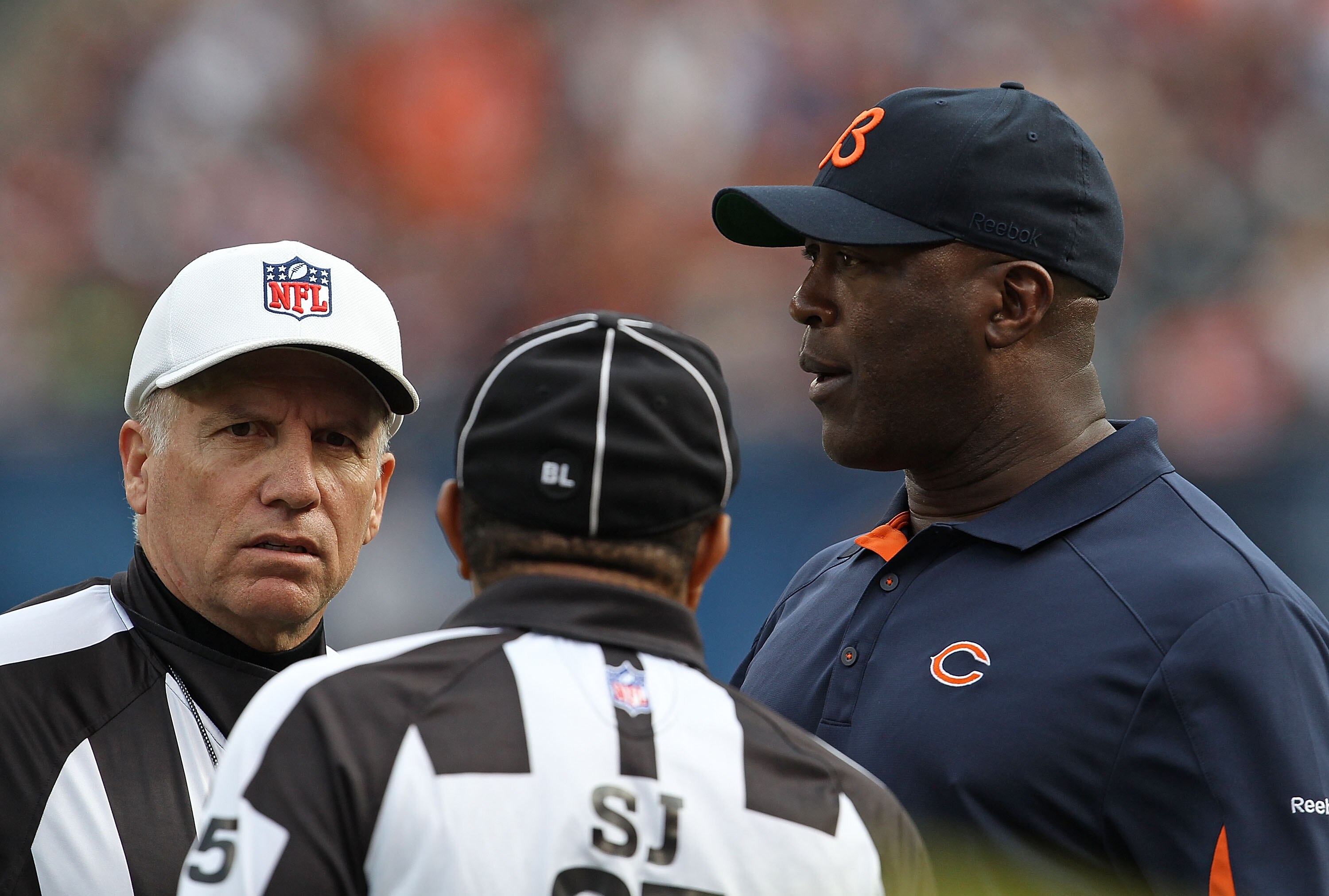 CHICAGO - OCTOBER 24: Head coach Lovie Smith of the Chicago Bears talks with referees during a game against the Washington Redskins at Soldier Field on October 24, 2010 in Chicago, Illinois. The Redskins defeated the Bears 17-14. (Photo by Jonathan Daniel