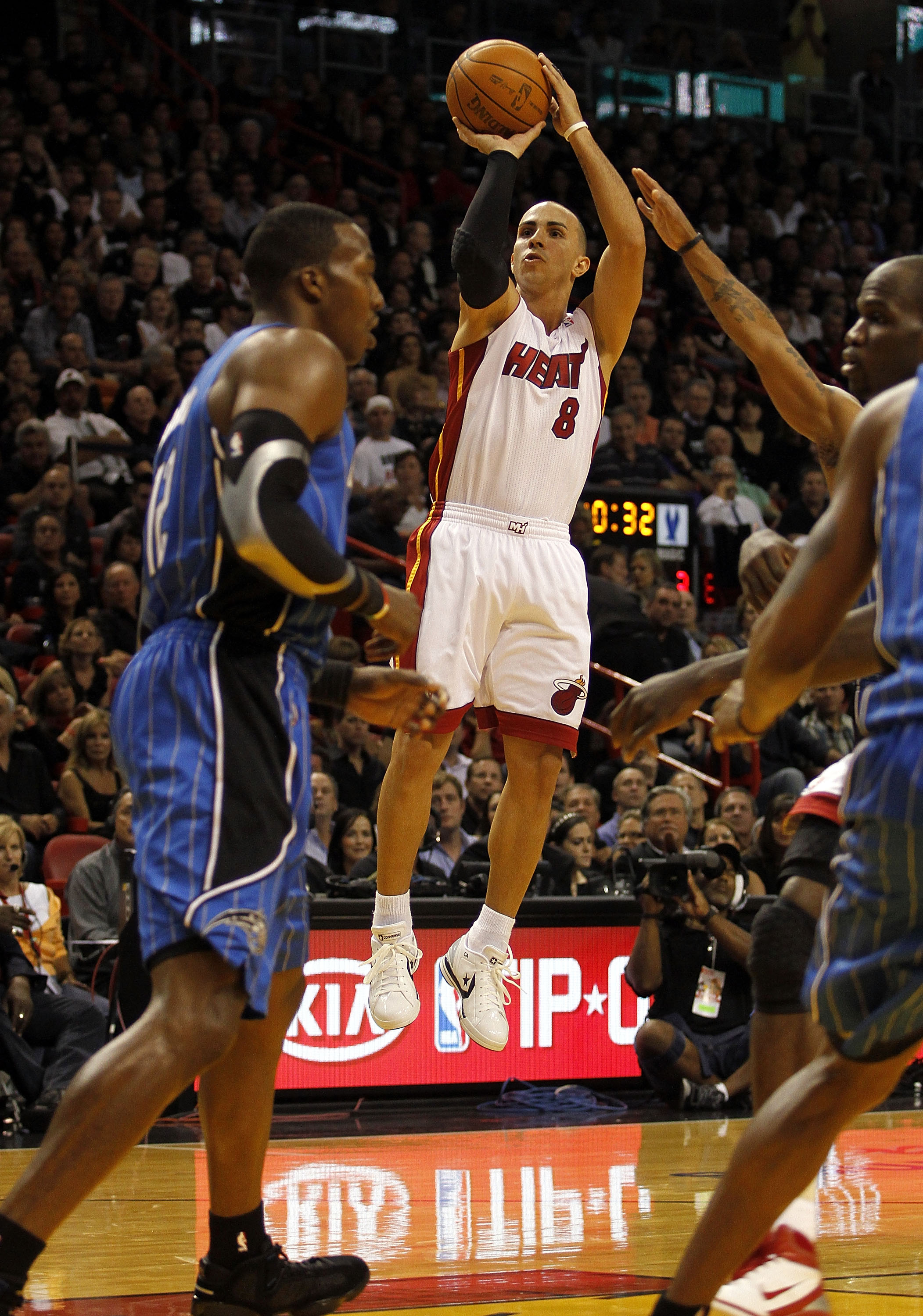 MIAMI - OCTOBER 29:  Guard Carlos Arroyo #8 of the Miami Heat shoots against the Orlando Magic at American Airlines Arena on October 29, 2010 in Miami, Florida.  NOTE TO USER: User expressly acknowledges and agrees that, by downloading and or using this p