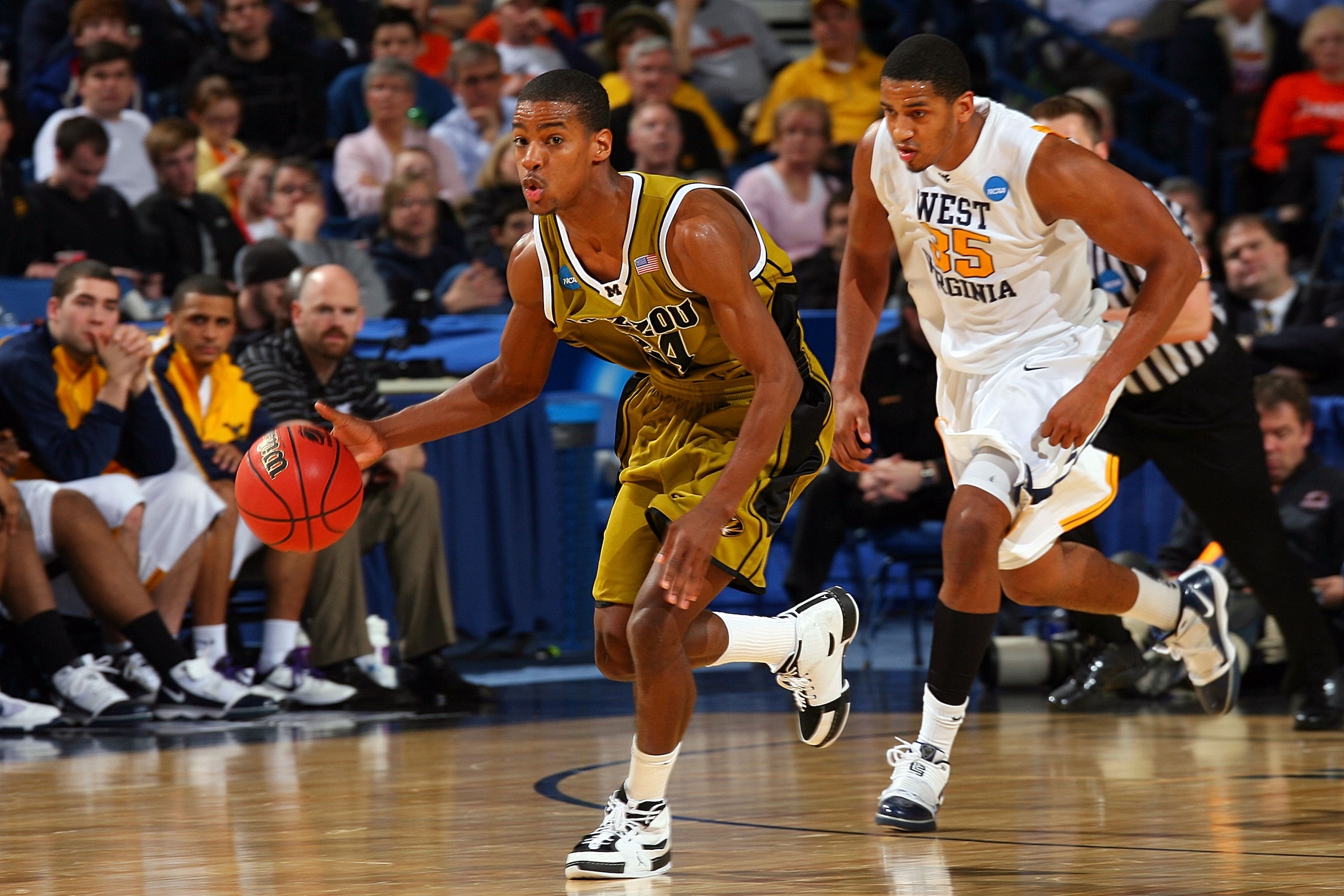 BUFFALO, NY - MARCH 21:  Kim English #24 of the Missouri Tigers takes the ball up court against Wellington Smith #35 of the West Virginia Mountaineers during the second round of the 2010 NCAA men's basketball tournament at HSBC Arena at HSBC Arena on Marc