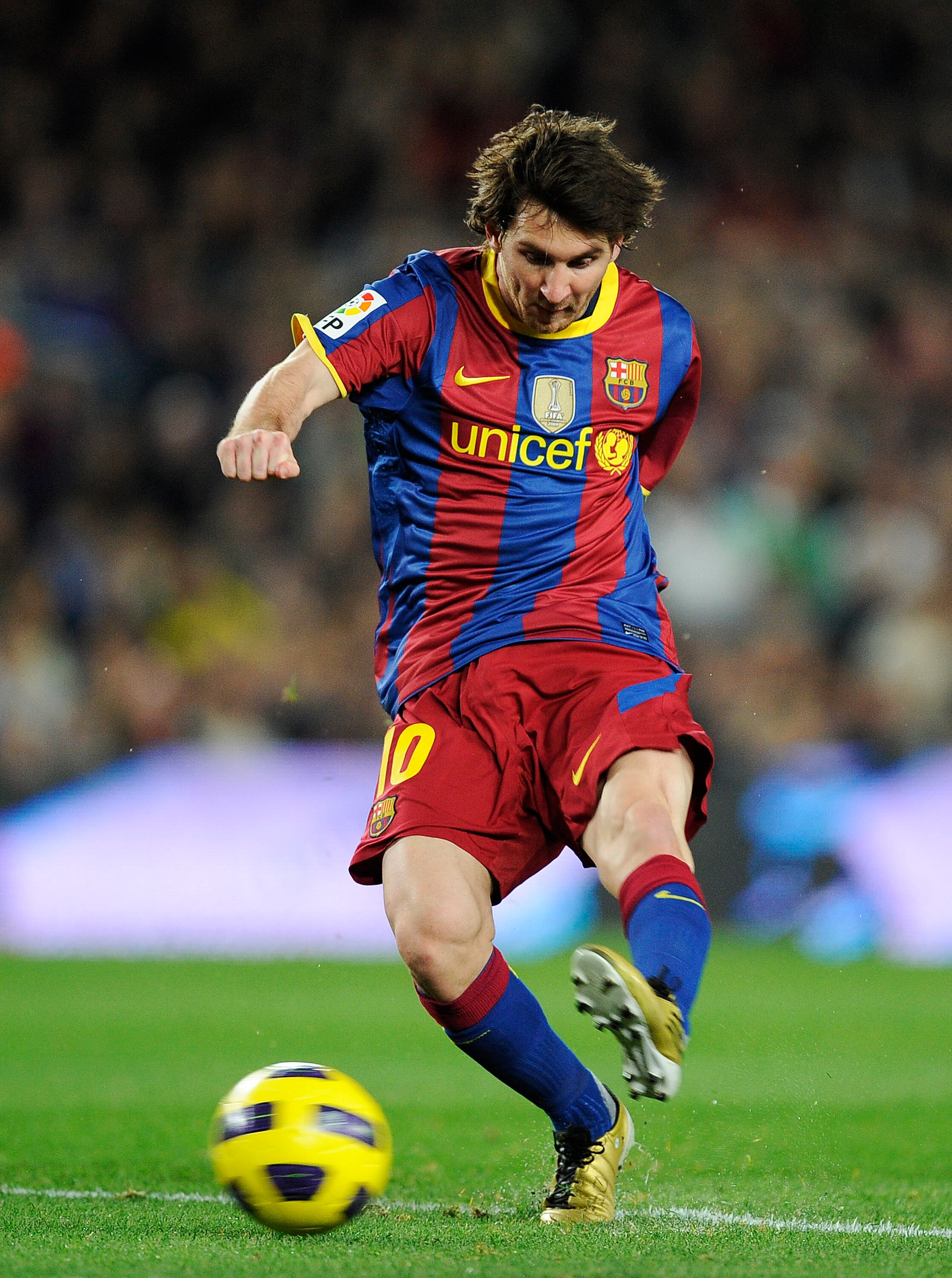 BARCELONA, SPAIN - OCTOBER 30:  Lionel Messi of Barcelona scores his second goal during the La Liga match between Barcelona and Sevilla FC on October 30, 2010 in Barcelona, Spain. Barcelona won the match 5-0.  (Photo by David Ramos/Getty Images)