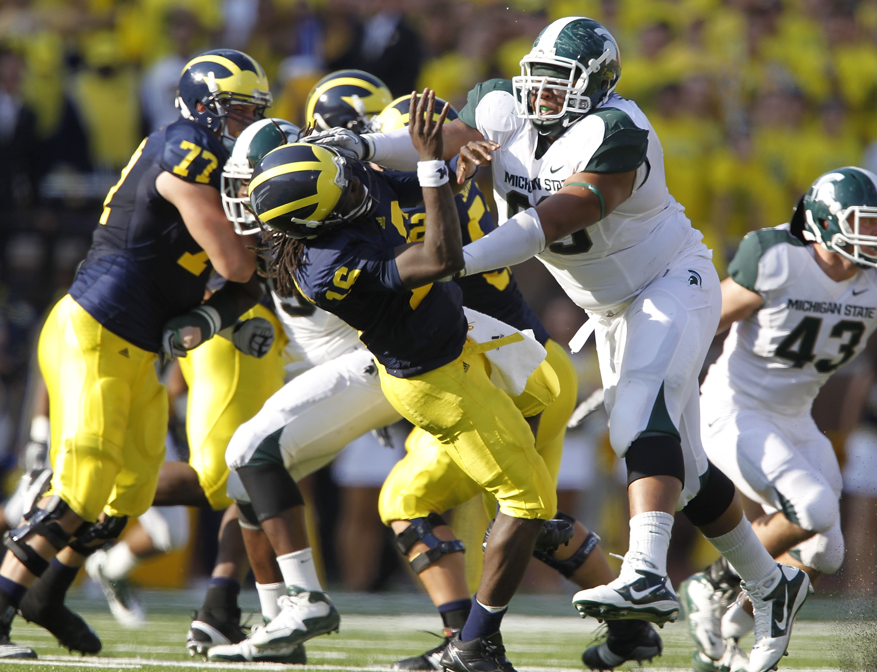 ANN ARBOR, MI - OCTOBER 09: Jerel Worthy #99 of the Michigan State Spartans hits Denard Robinson #16 of the Michigan Wolverines during the game on October 9, 2010 at Michigan Stadium in Ann Arbor, Michigan. (Photo by Leon Halip/Getty Images) ANN ARBOR, MI - OCTOBER 09: Jerel Worthy #99 of the Michigan State Spartans hits Denard Robinson #16 of the Michigan Wolverines during the game on October 9, 2010 at Michigan Stadium in Ann Arbor, Michigan. (Photo by Leon Halip/Getty Images)