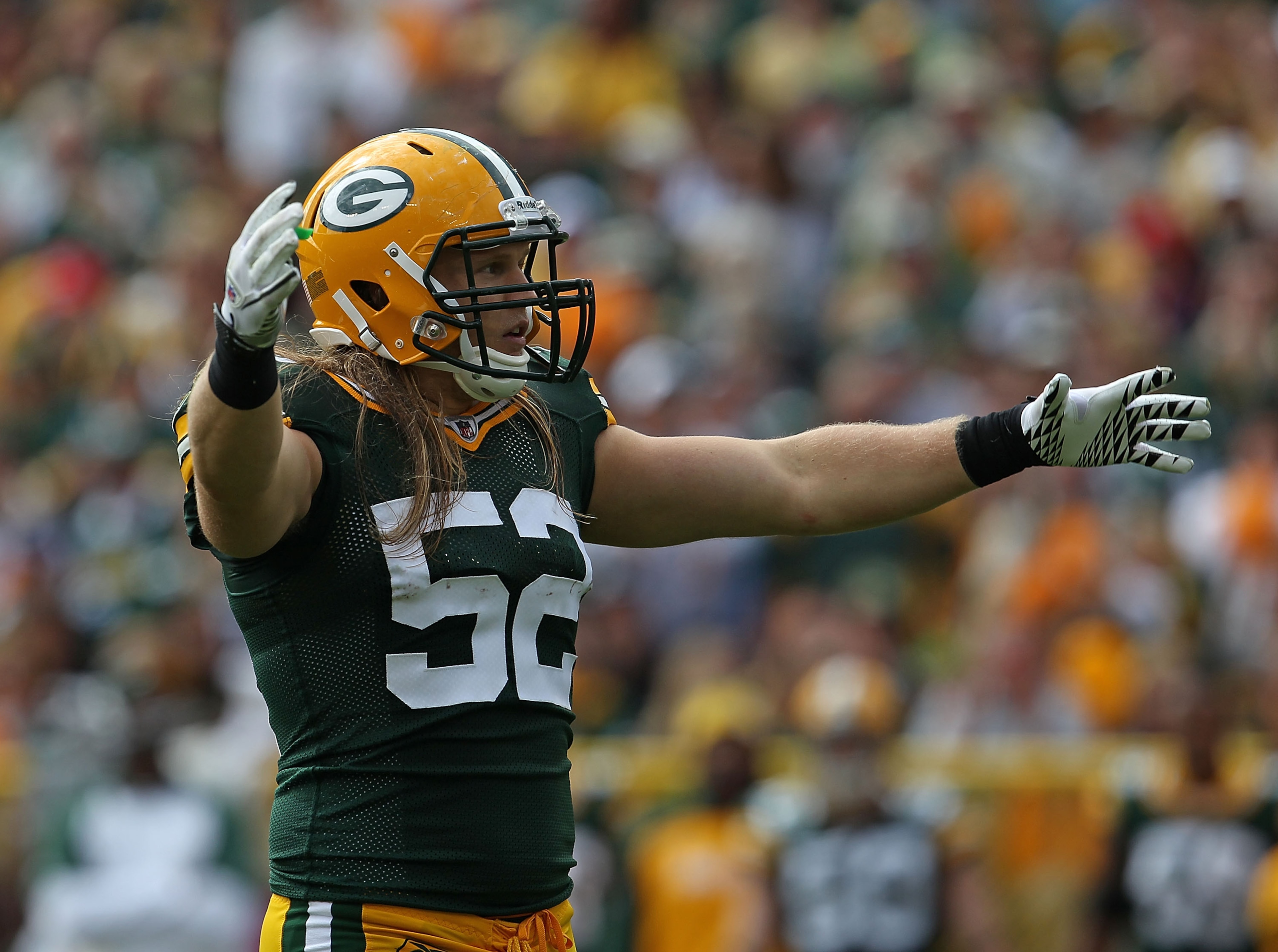 GREEN BAY, WI - SEPTEMBER 19: Clay Matthews #52 of the Green Bay Packers encourages the crowd during a game against the Buffalo Bills at Lambeau Field on September 19, 2010 in Green Bay, Wisconsin. The Packers defeated the Bills 34-7.  (Photo by Jonathan 