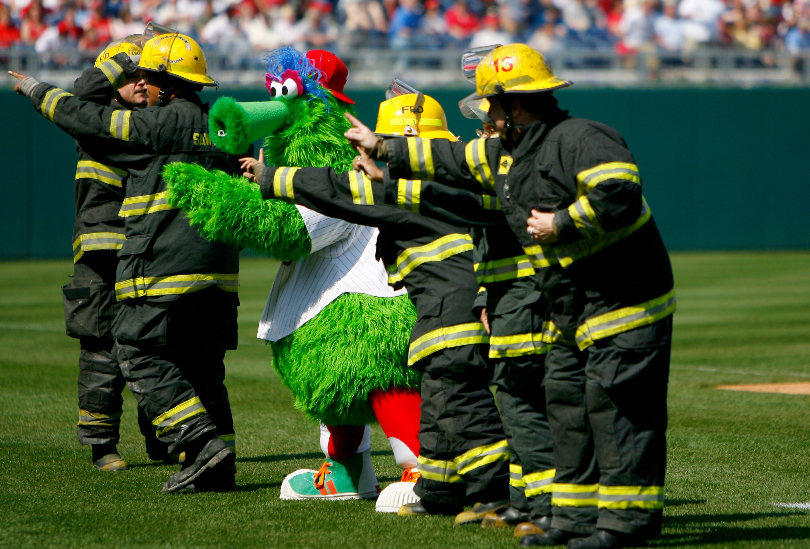 PHILADELPHIA, PA - APRIL 2:  The Phillie Fanatic entertains the crowd along with firefighters during the Atlanta Braves and Philadelphia Phillies game during a Opening Day game on April 2, 2007 at Citizens Bank Park in Philadelphia, Pennsylvania. (Photo b