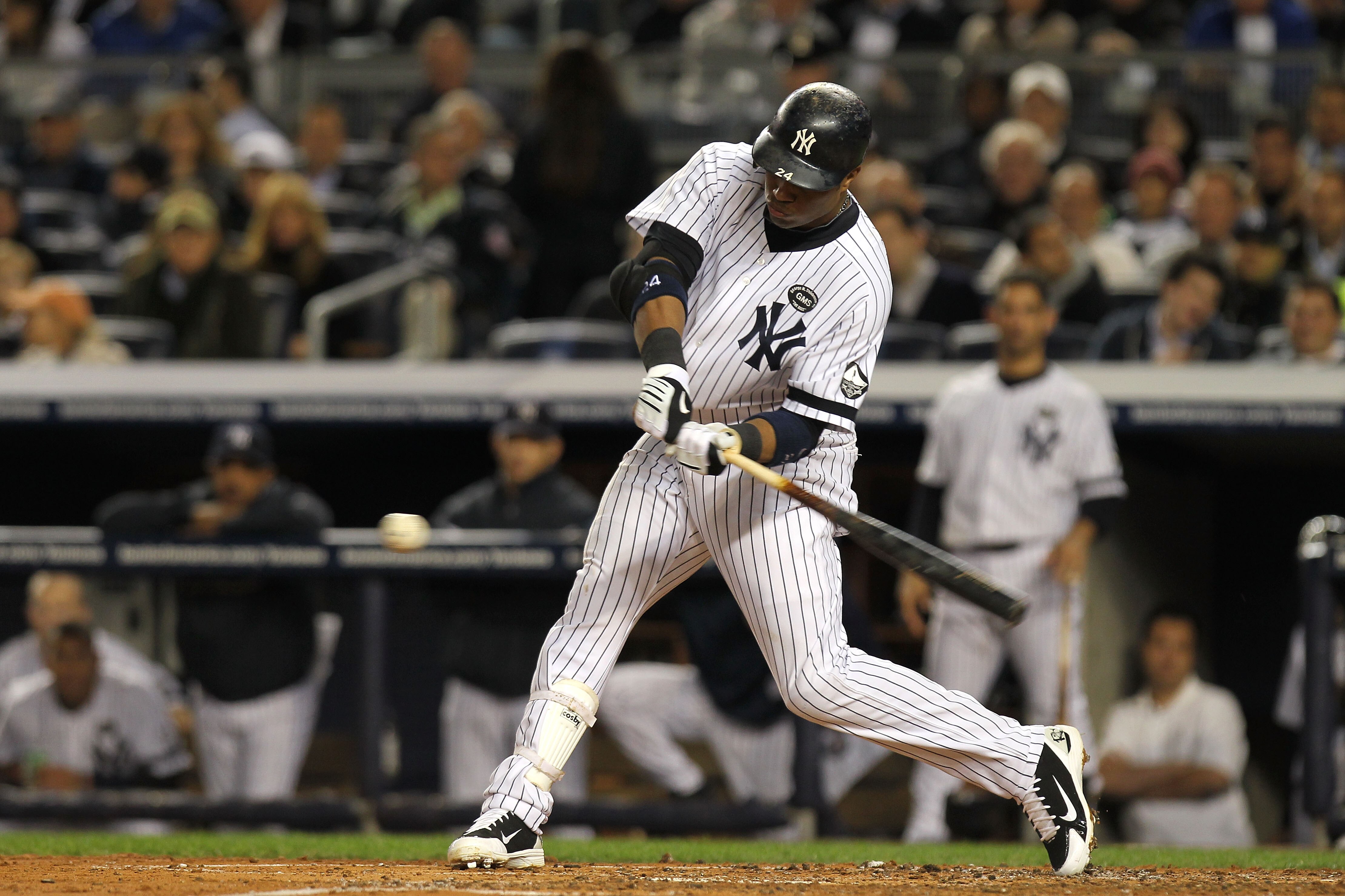 NEW YORK - OCTOBER 18:  Robinson Cano #24 of the New York Yankees bats against the Texas Rangers in Game Three of the ALCS during the 2010 MLB Playoffs at Yankee Stadium on October 18, 2010 in New York, New York.  (Photo by Nick Laham/Getty Images)