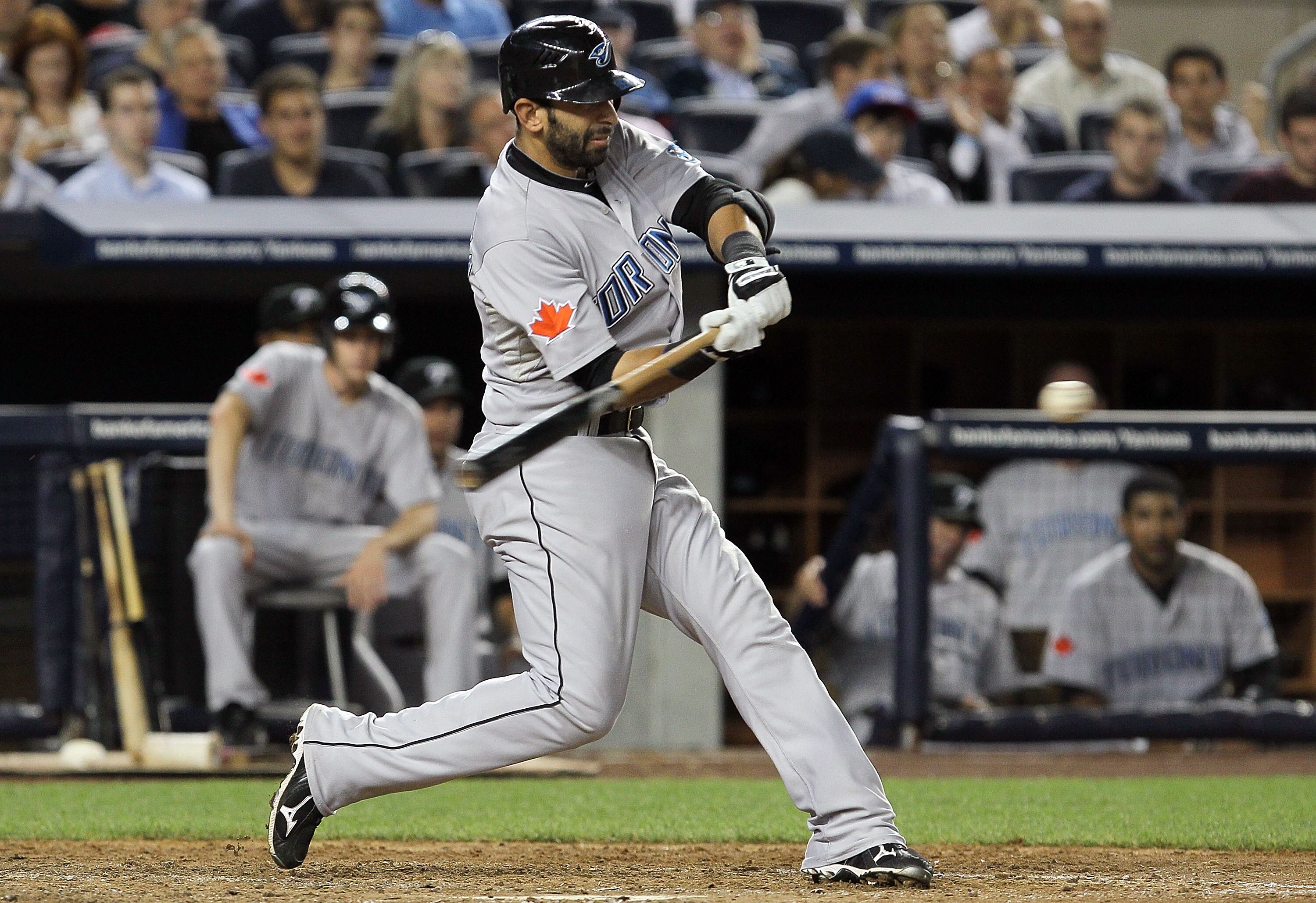 NEW YORK - AUGUST 02:  Jose Bautista #19 of the Toronto Blue Jays connects on a fifth inning two run double against the New York Yankees on August 2, 2010 at Yankee Stadium in the Bronx borough of New York City.  (Photo by Jim McIsaac/Getty Images)