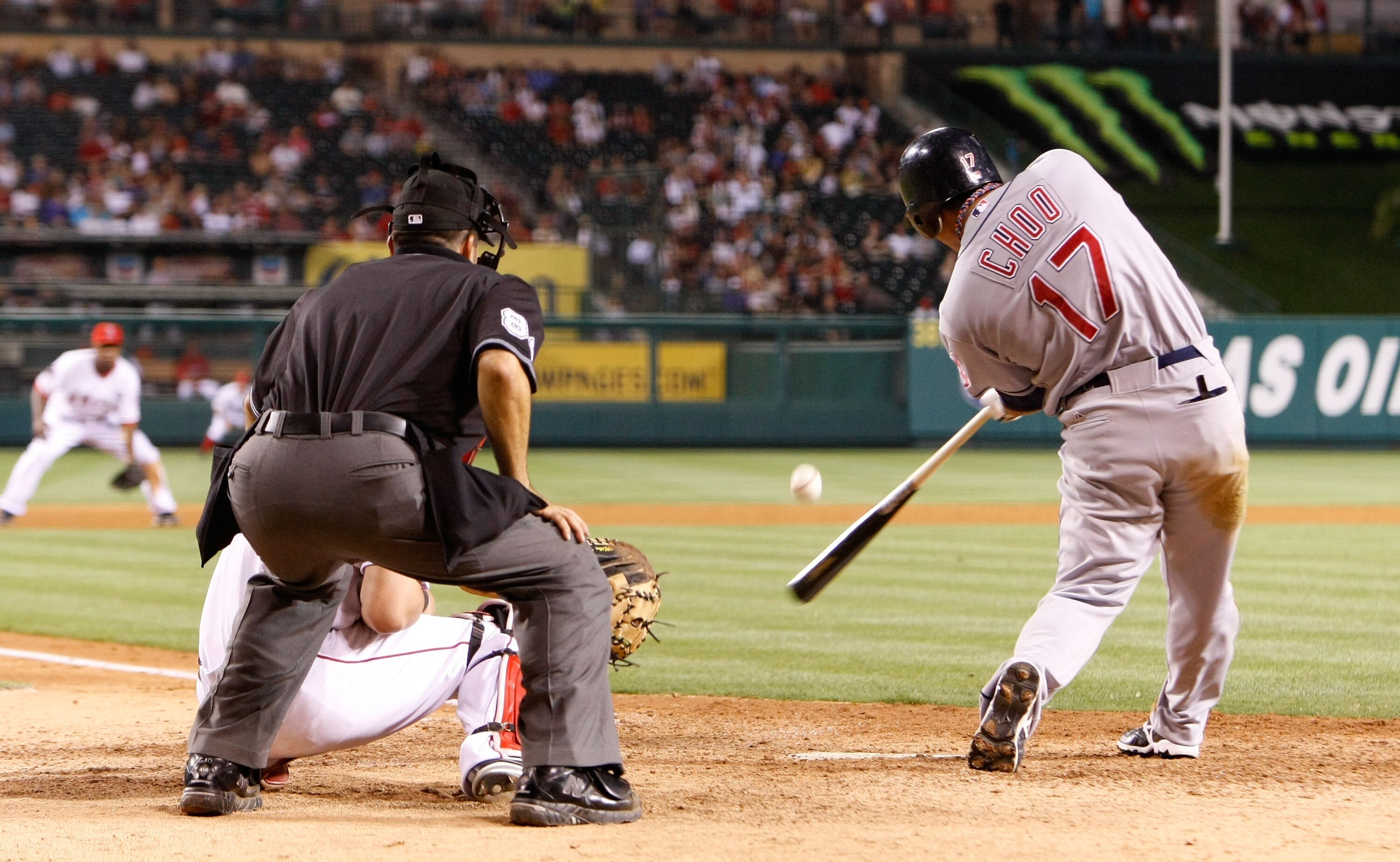 ANAHEIM, CA - JULY 27:  Shin-Soo Choo #17 of the Cleveland Indians hits a single against the Los Angeles Angels of Anaheim in the ninth inning at Angel Stadium on July 27, 2009 in Anaheim, California. The Indians defeated the Angels 8-6.  (Photo by Jeff G