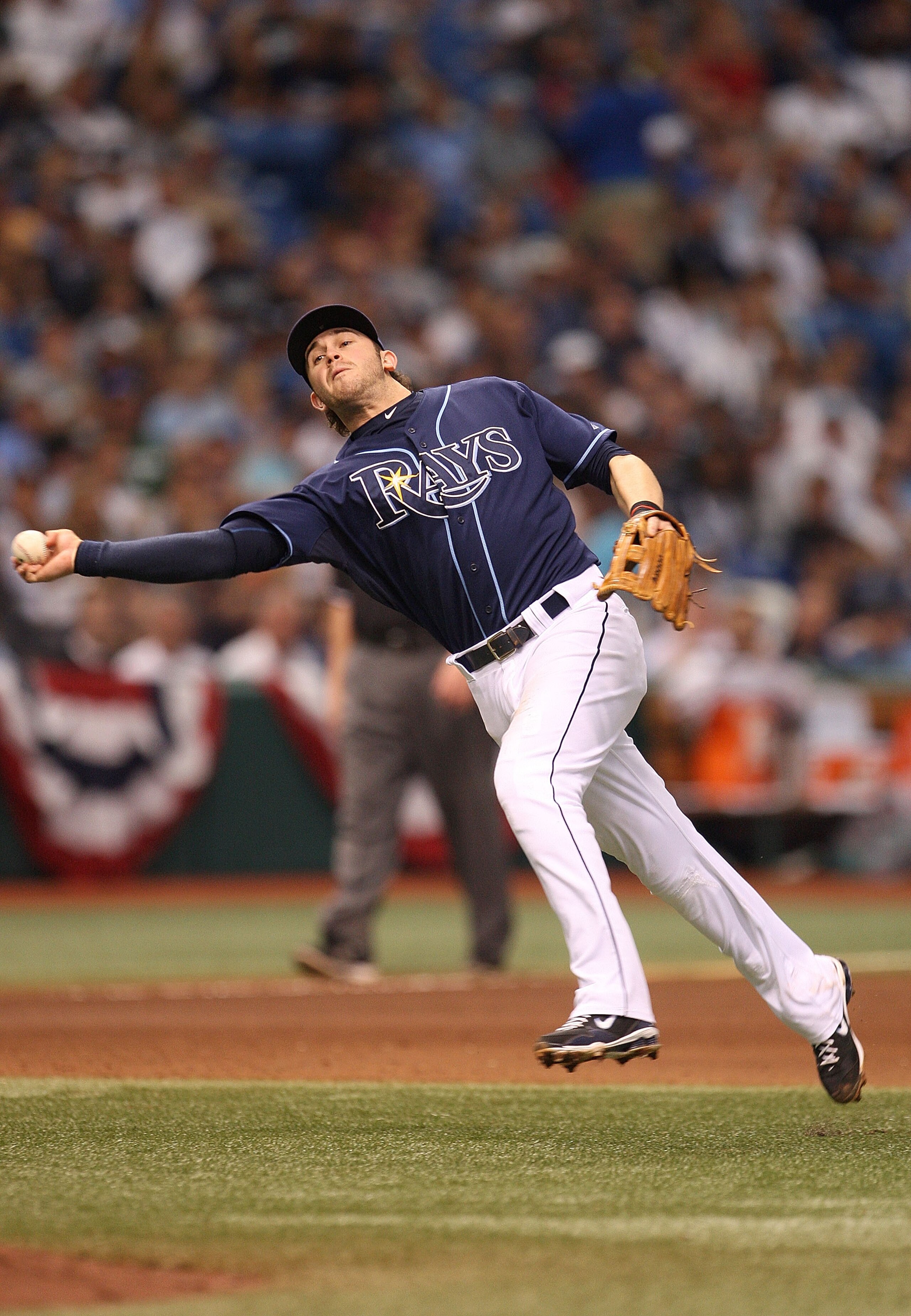 ST PETERSBURG, FL - OCTOBER 07: Evan Longoria #3 of the Tampa Bay Rays makes a throw to first during Game 2 of the ALDS against the Texas Rangers at Tropicana Field on October 7, 2010 in St. Petersburg, Florida. (Photo by Mike Ehrmann/Getty Images) ST PETERSBURG, FL - OCTOBER 07: Evan Longoria #3 of the Tampa Bay Rays makes a throw to first during Game 2 of the ALDS against the Texas Rangers at Tropicana Field on October 7, 2010 in St. Petersburg, Florida. (Photo by Mike Ehrmann/Getty Images)