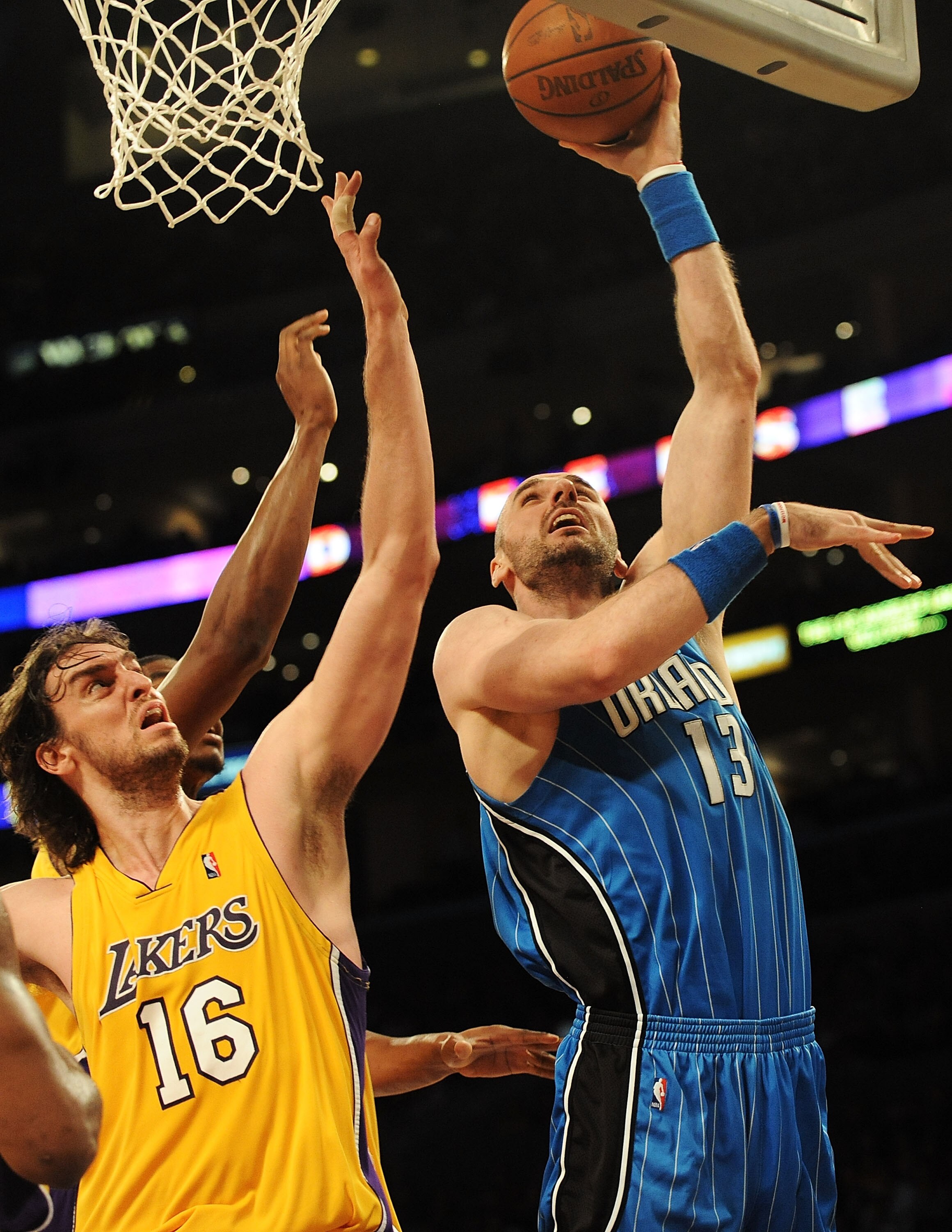 LOS ANGELES, CA - JANUARY 18:  Marcin Gortat #13 of the Orlando Magic goes to the basket against Pau Gasol #16 of the Los Angeles Lakers in the third quarter during the game on January 18, 2010 at Staples Center in Los Angeles, California. NOTE TO USER: U