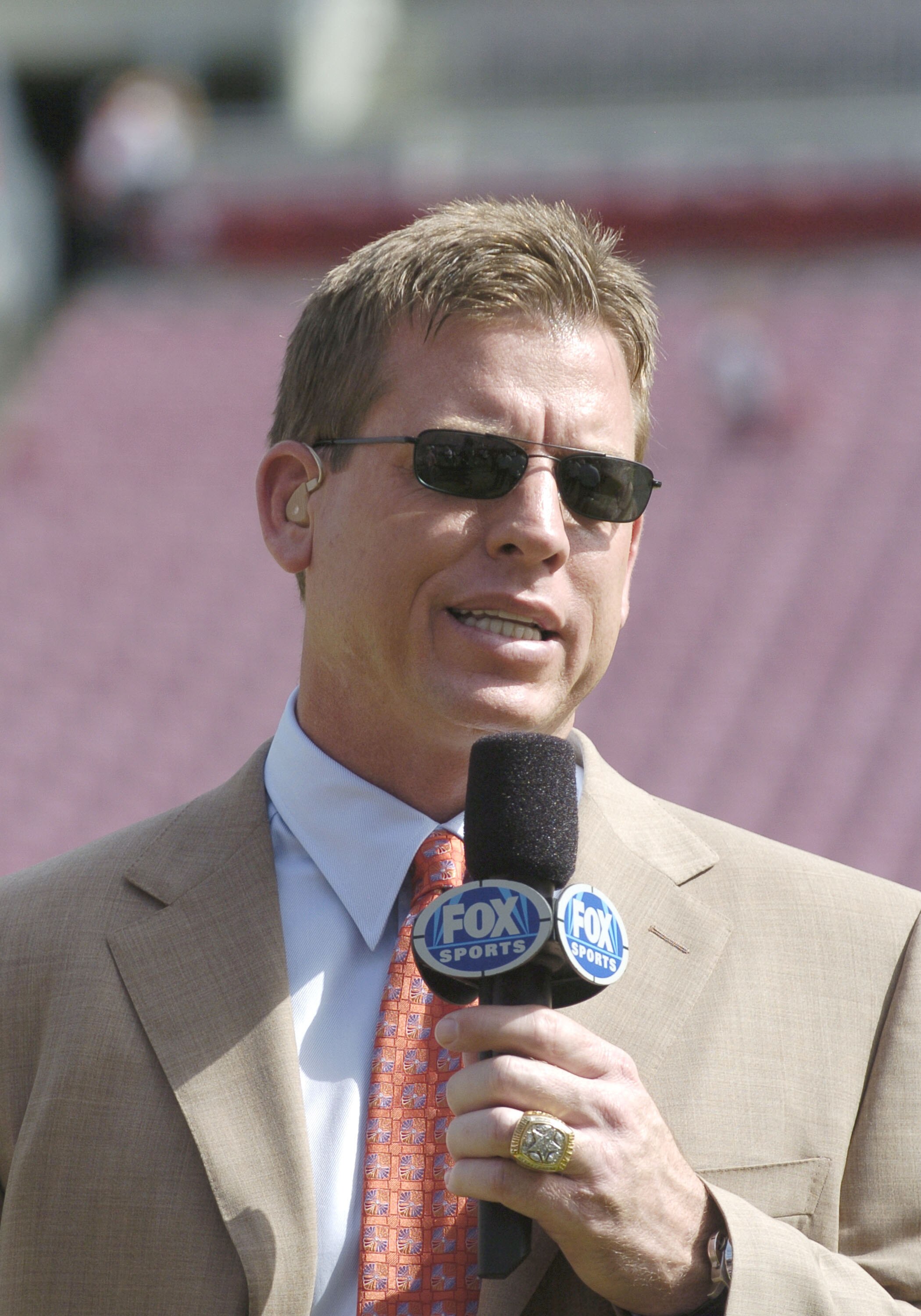 FOX TV's Troy Aikman provides pre-game  commentary before the Tampa Bay Buccaneers meet the Carolina Panthers November 6, 2005 in Tampa.  The Panthers defeated the Bucs 34 - 14.  (Photo by Al Messerschmidt/Getty Images)